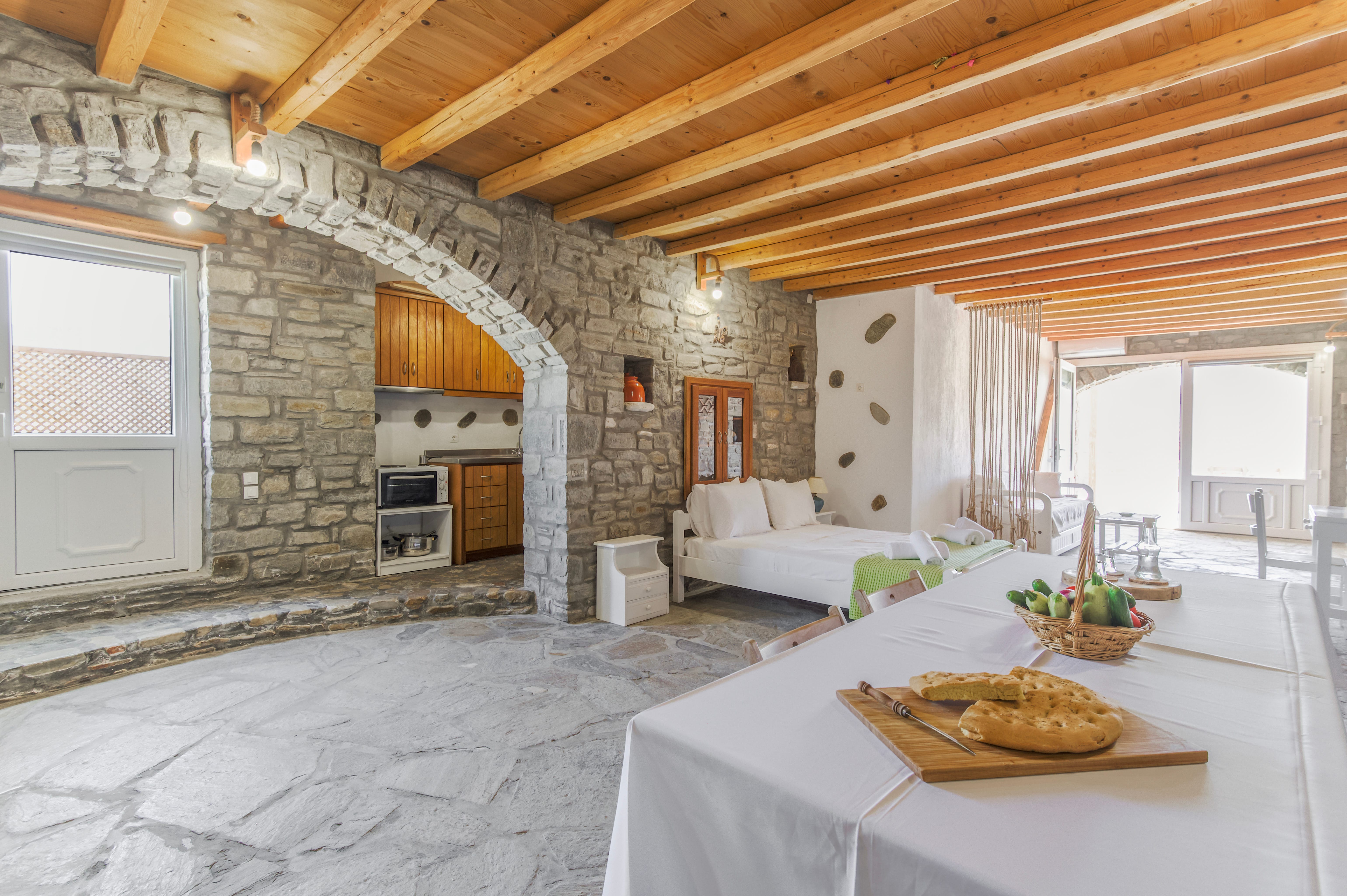 a living room with a stone fireplace