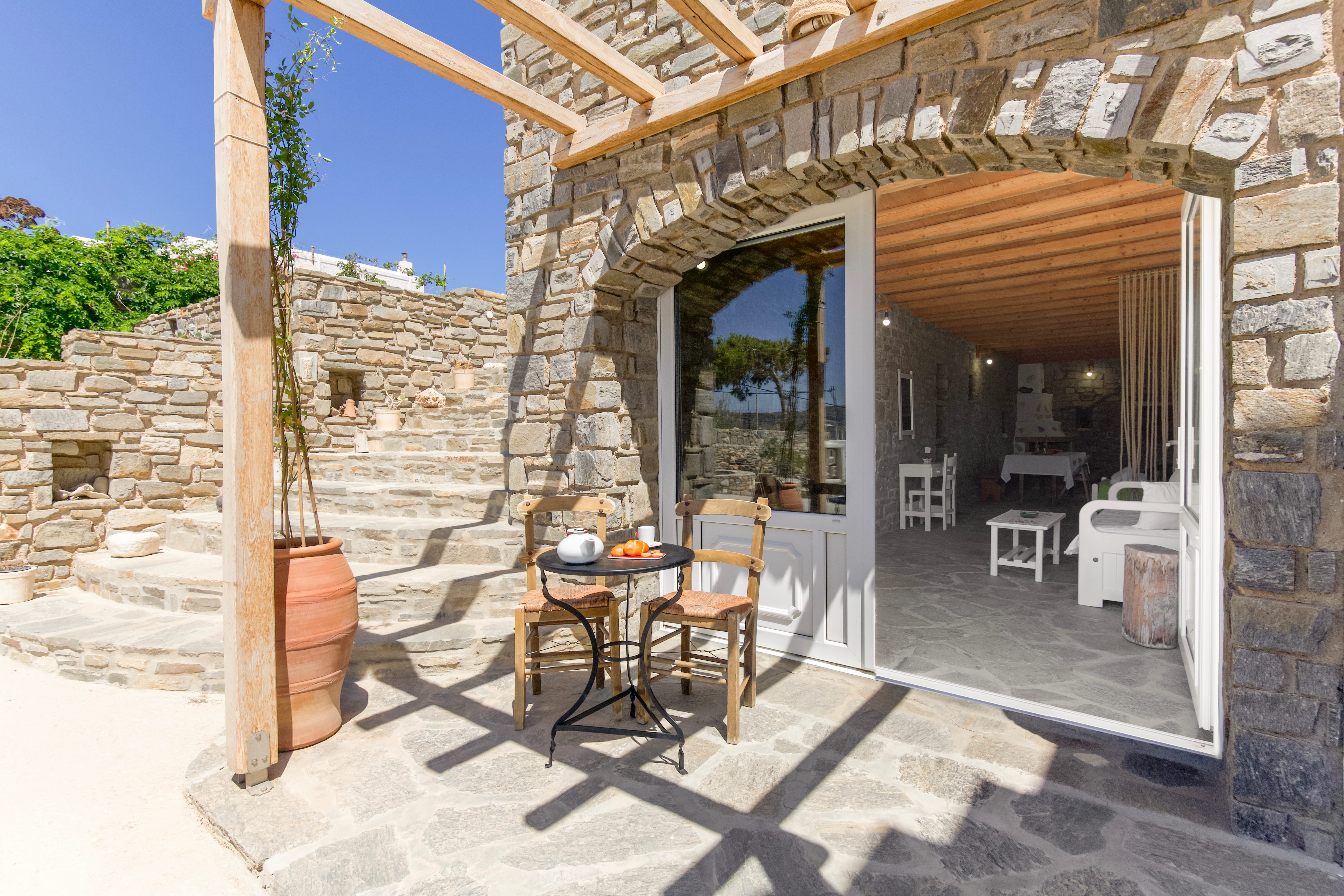 a patio with a table and chairs