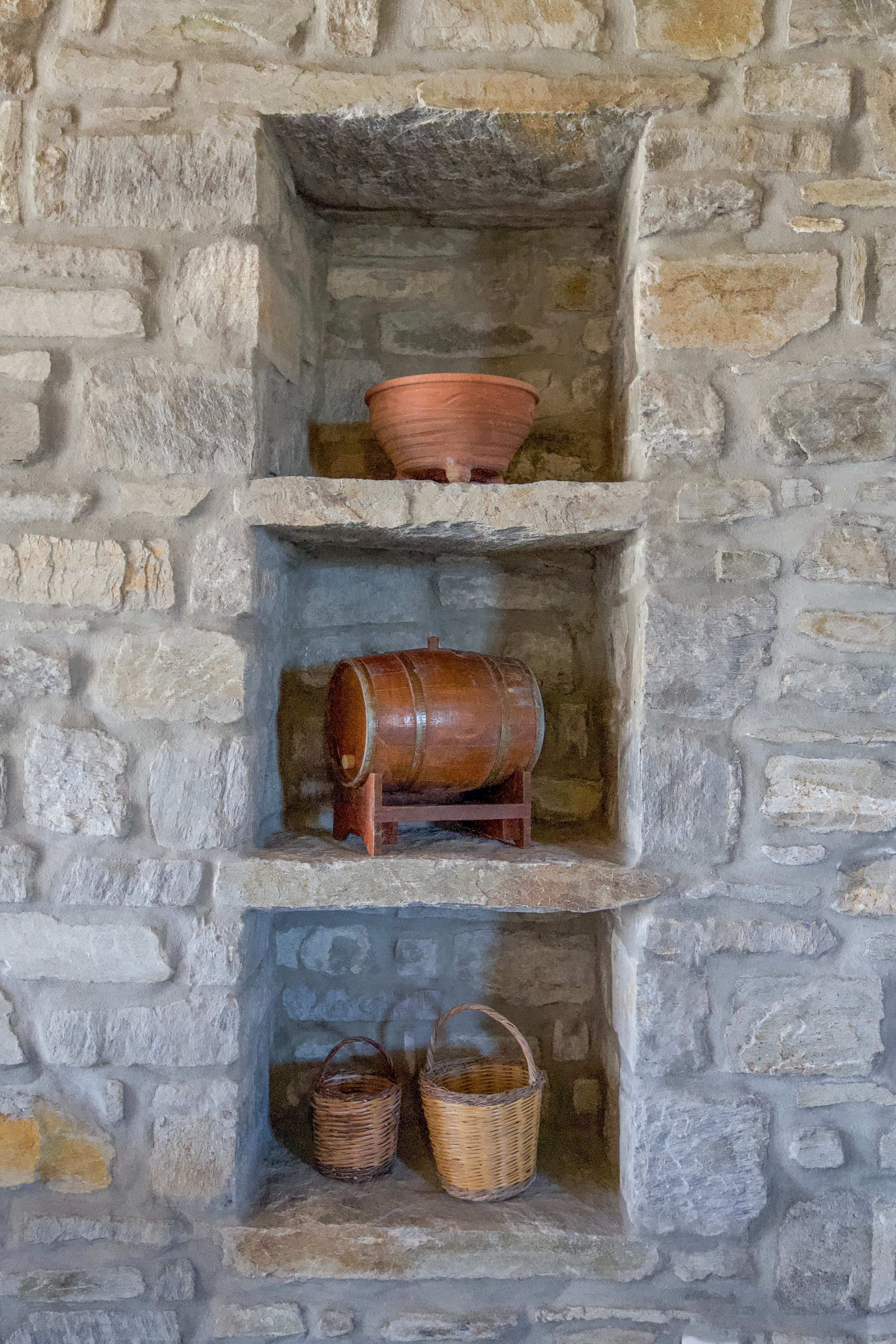 a fireplace with a pot and basket
