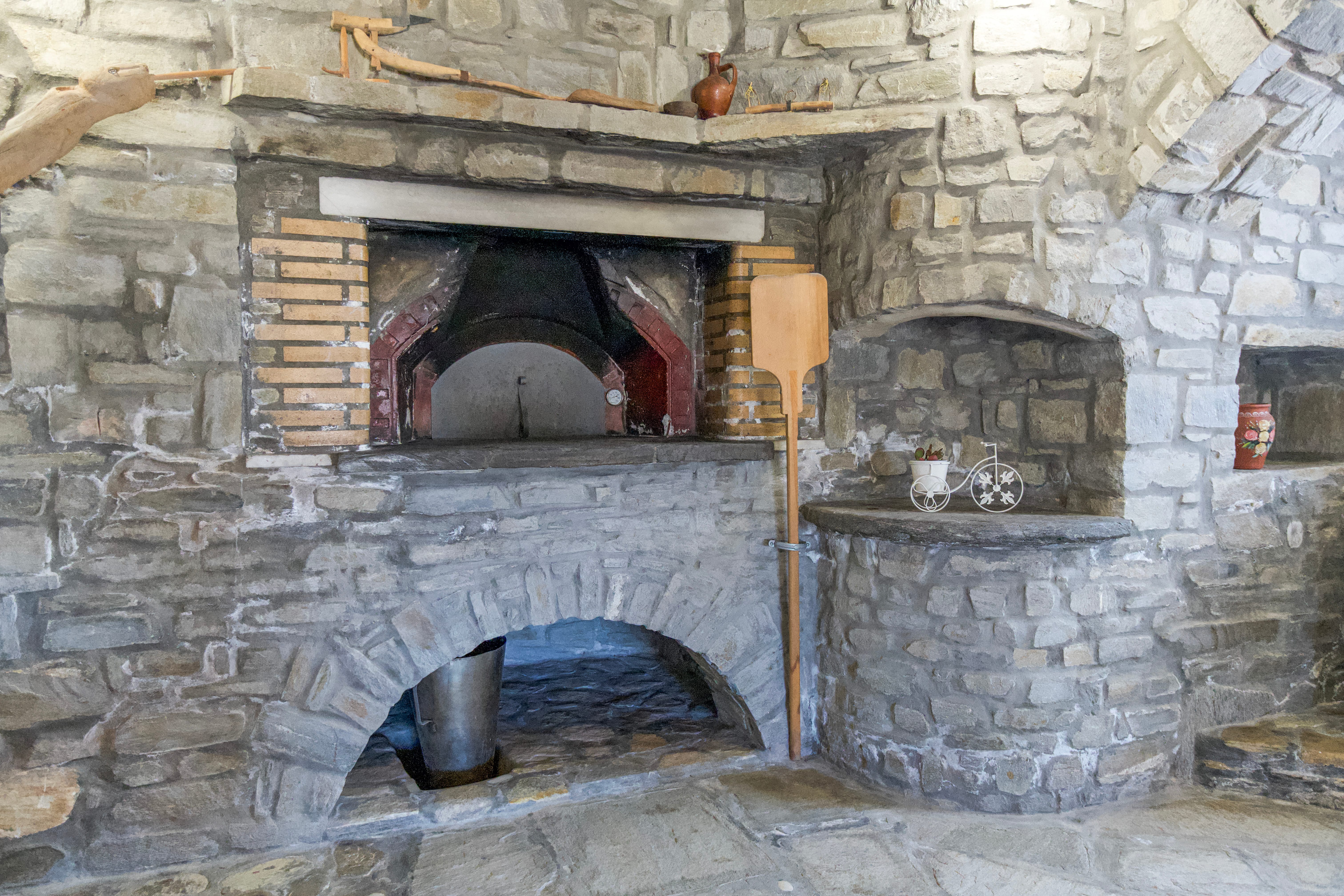a fireplace in a stone building
