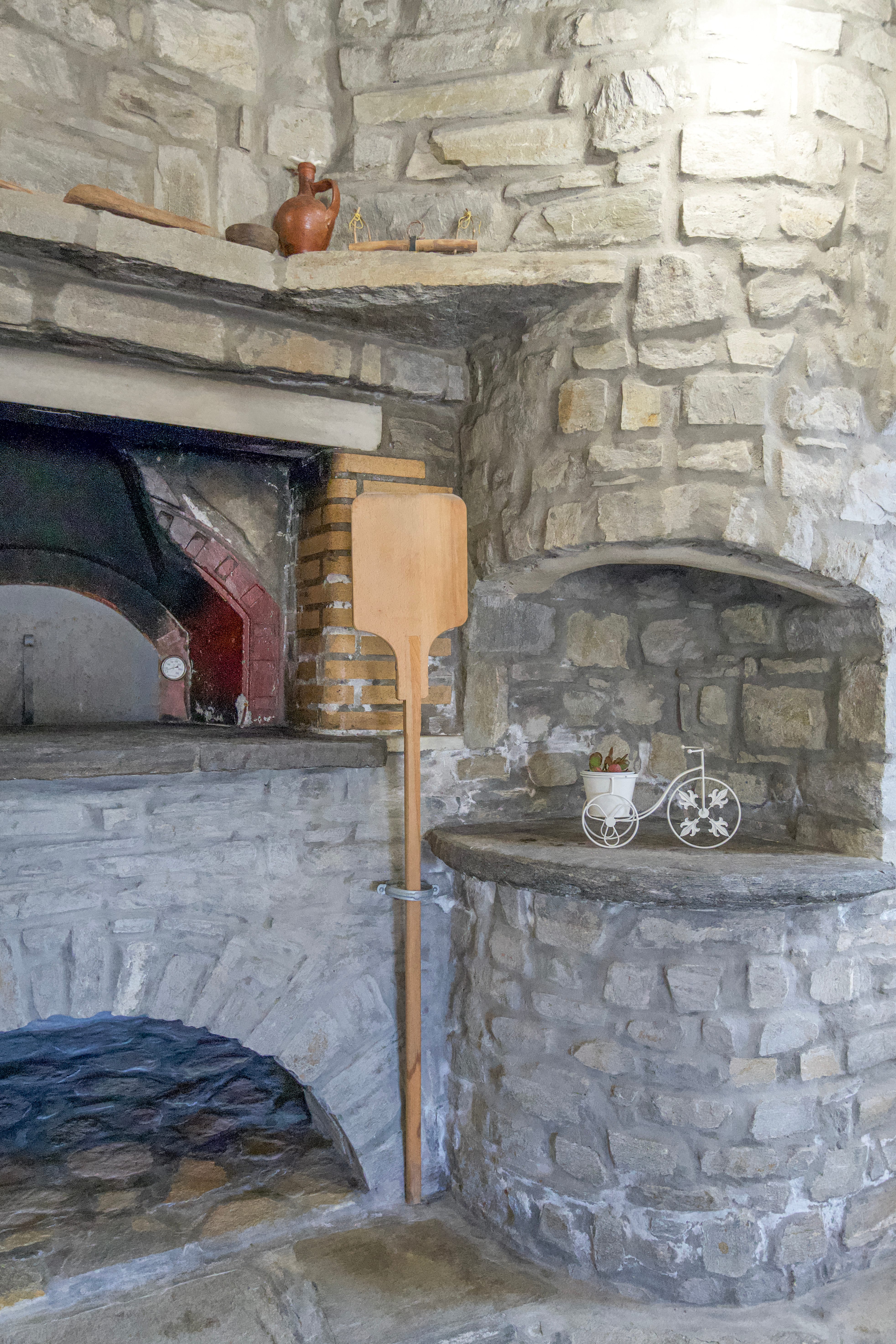 a fireplace with a stone wall