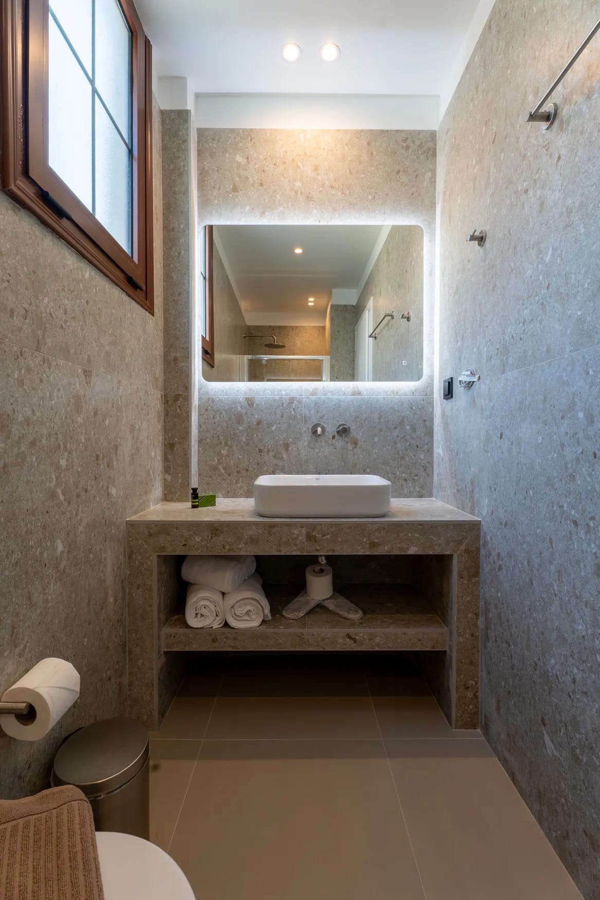 a bathroom with a mirror and a sink