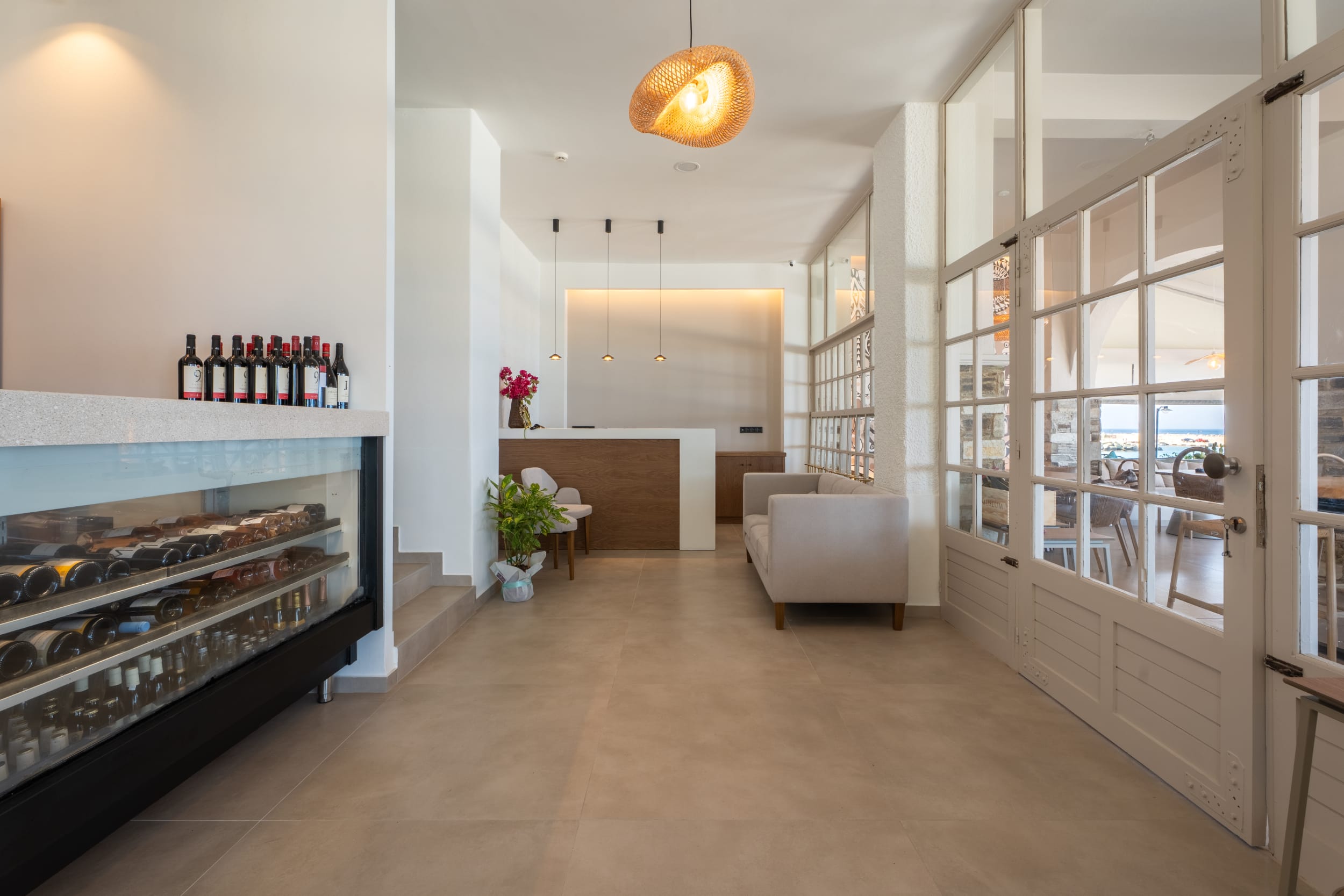 a room with a large glass door and a large glass wall