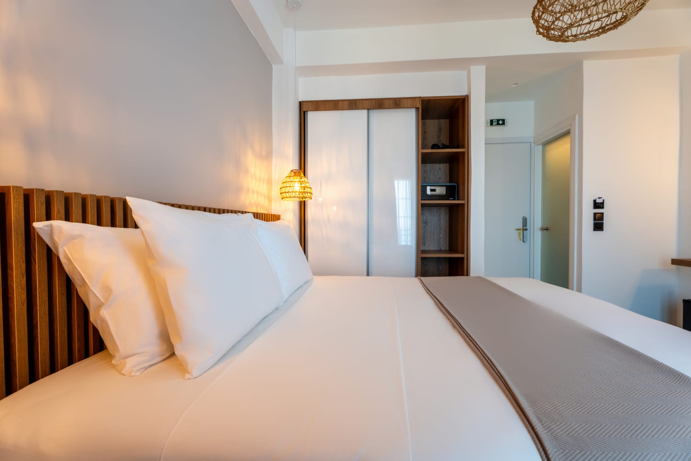a bed with a white bed spread