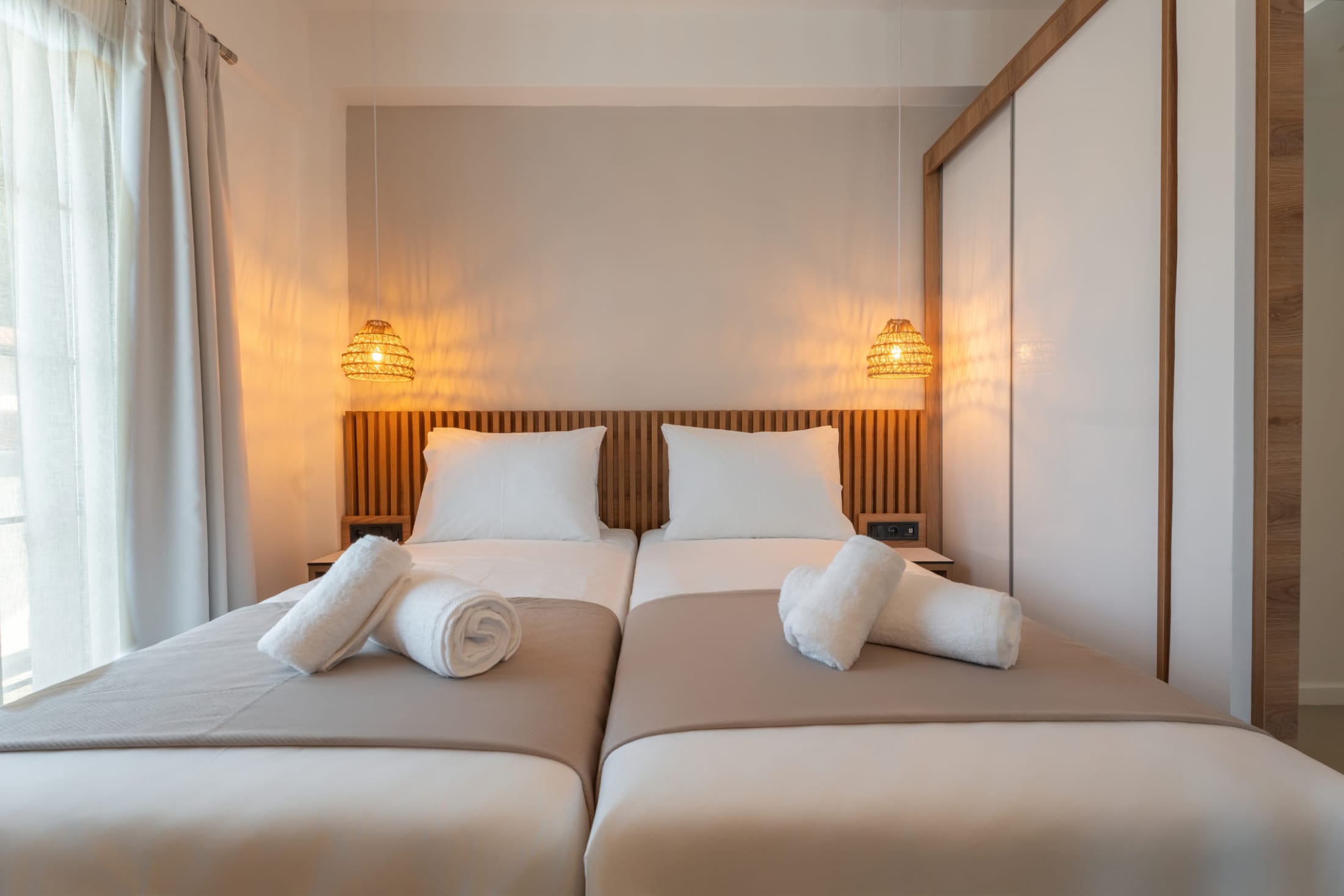 a hotel room with two beds