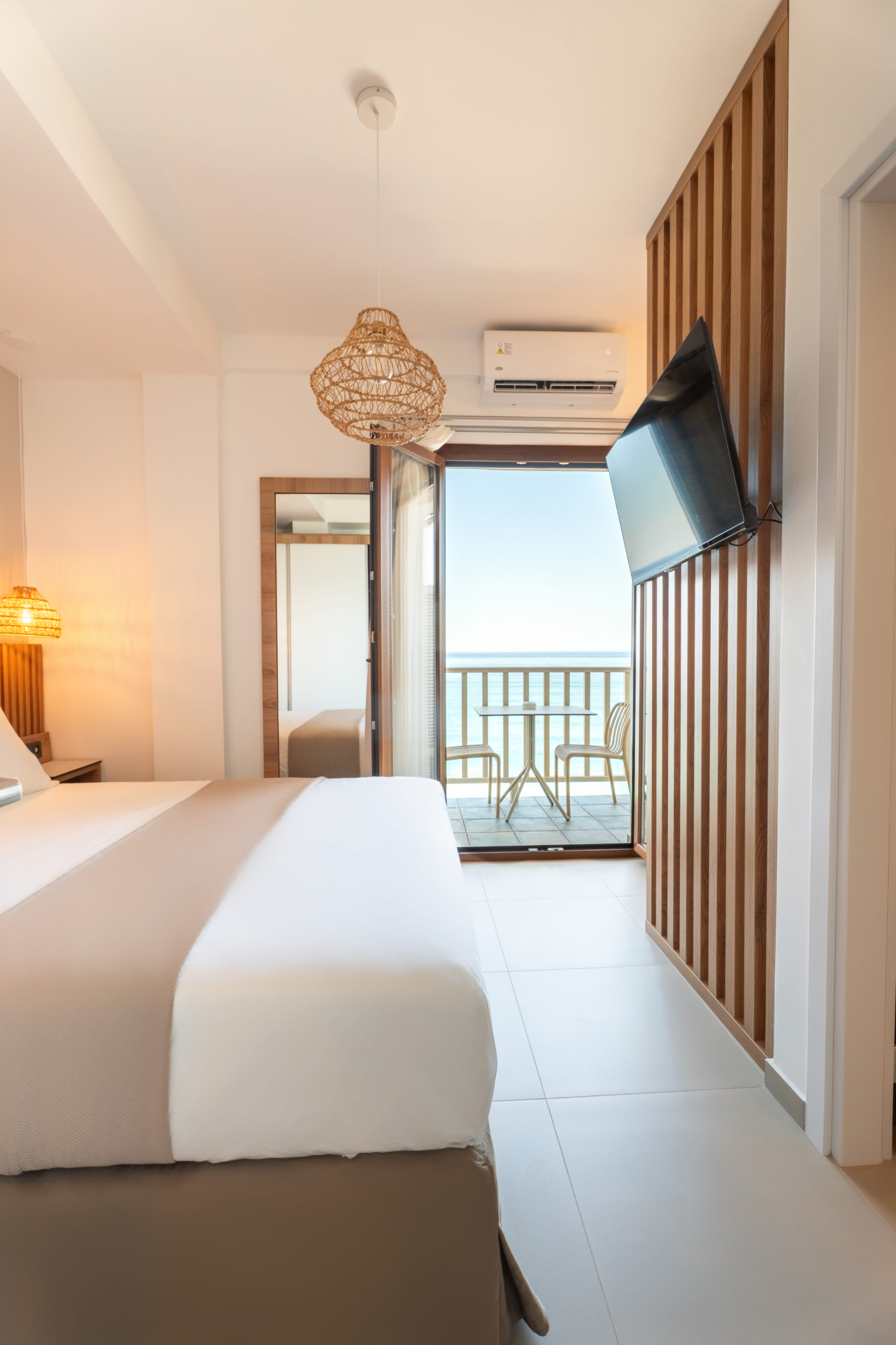 a bedroom with a large balcony