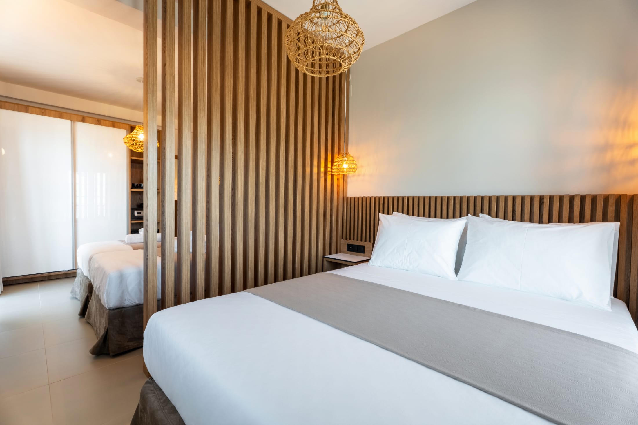 a hotel room with two beds