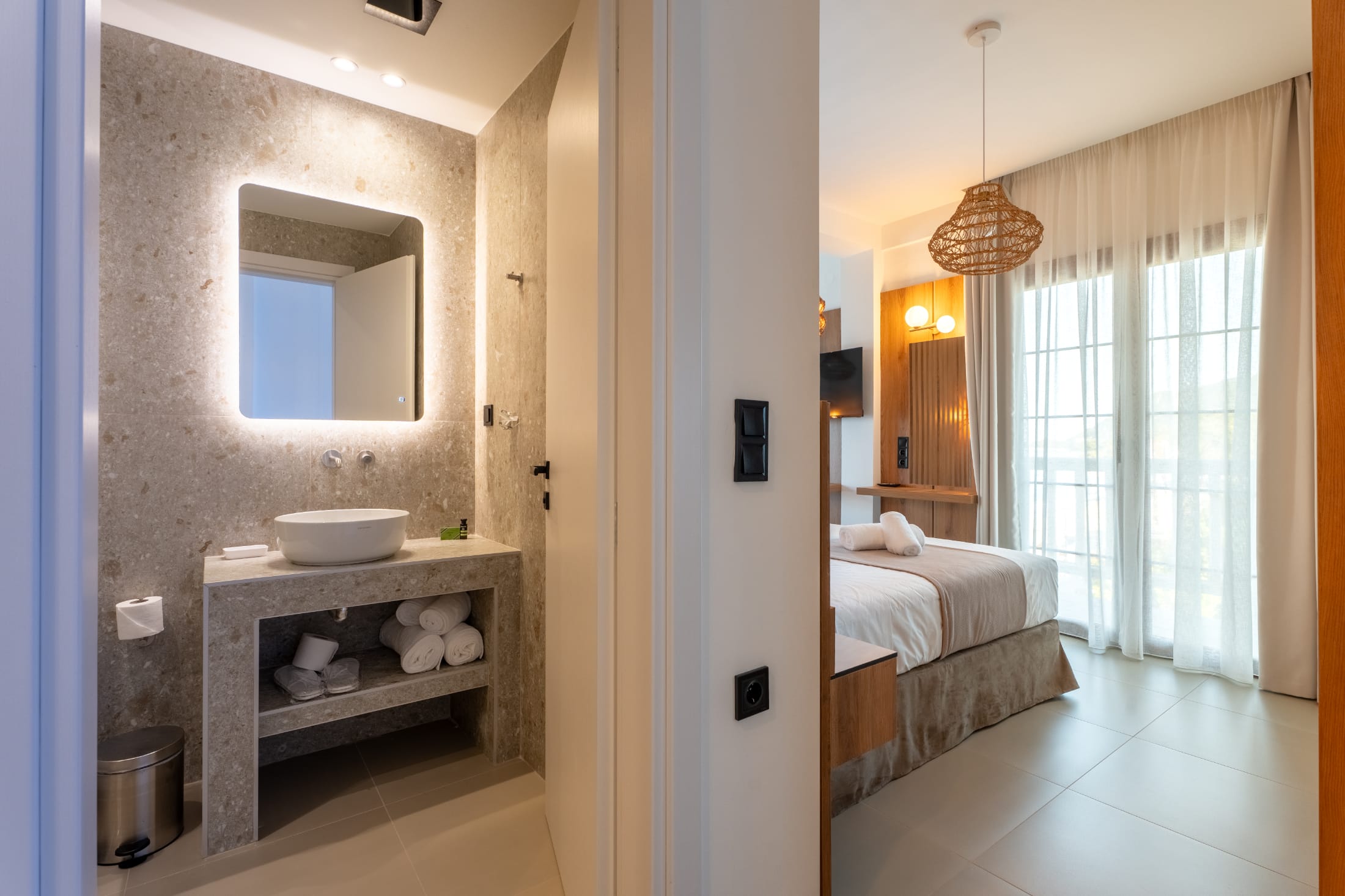a bathroom with a sink and a bed