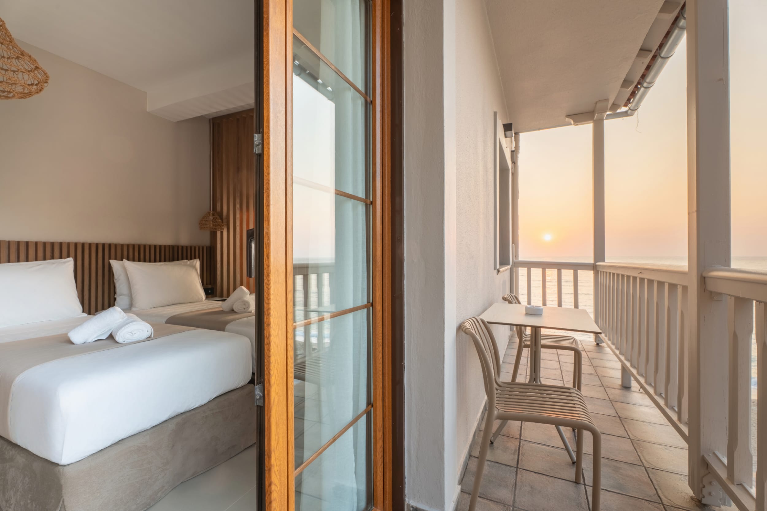 a bedroom with a bed and a chair