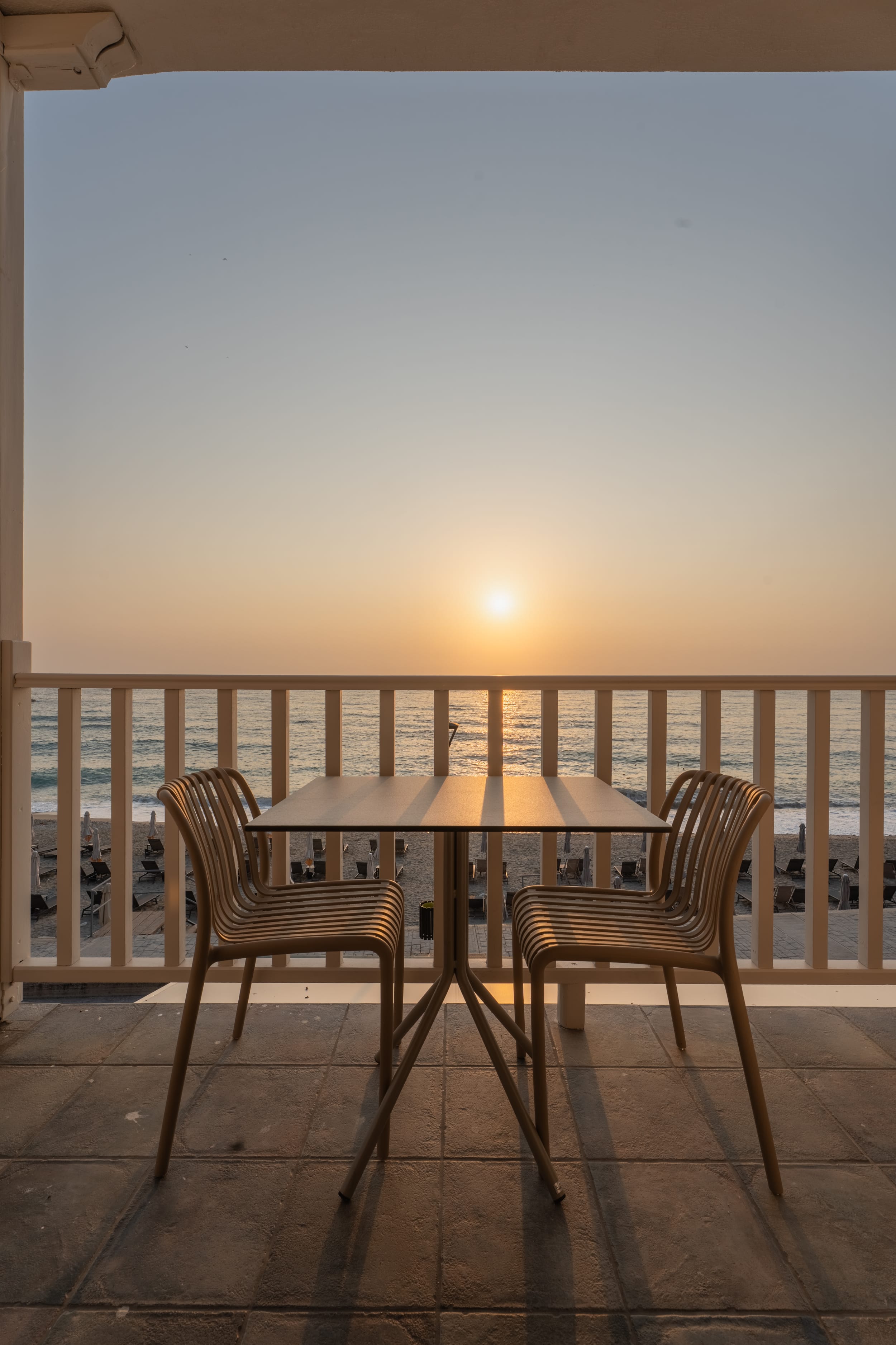 a table and chairs on a deck