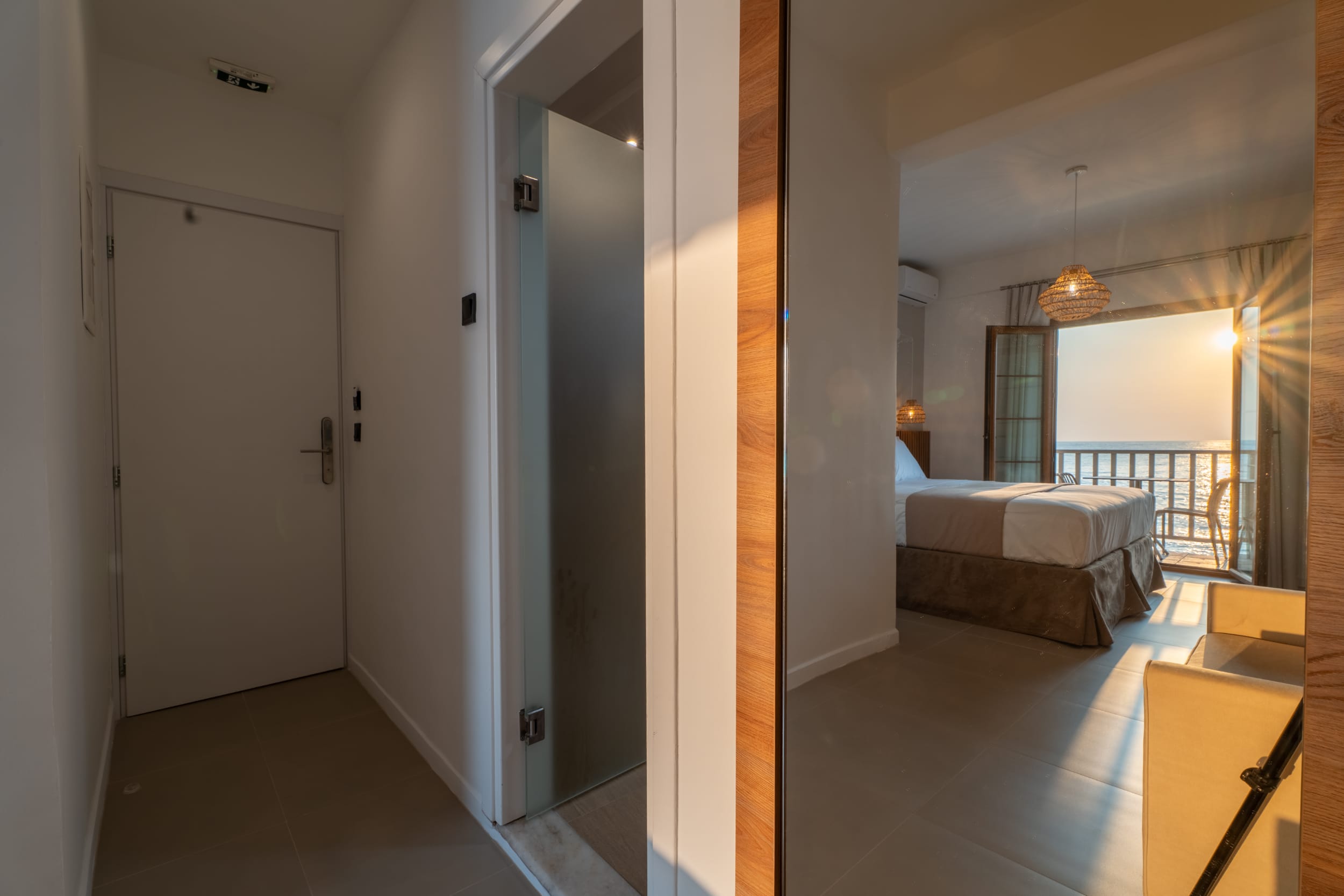 a hotel room with a bed and a bed