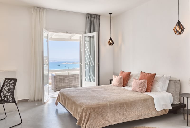 a bedroom with a large window