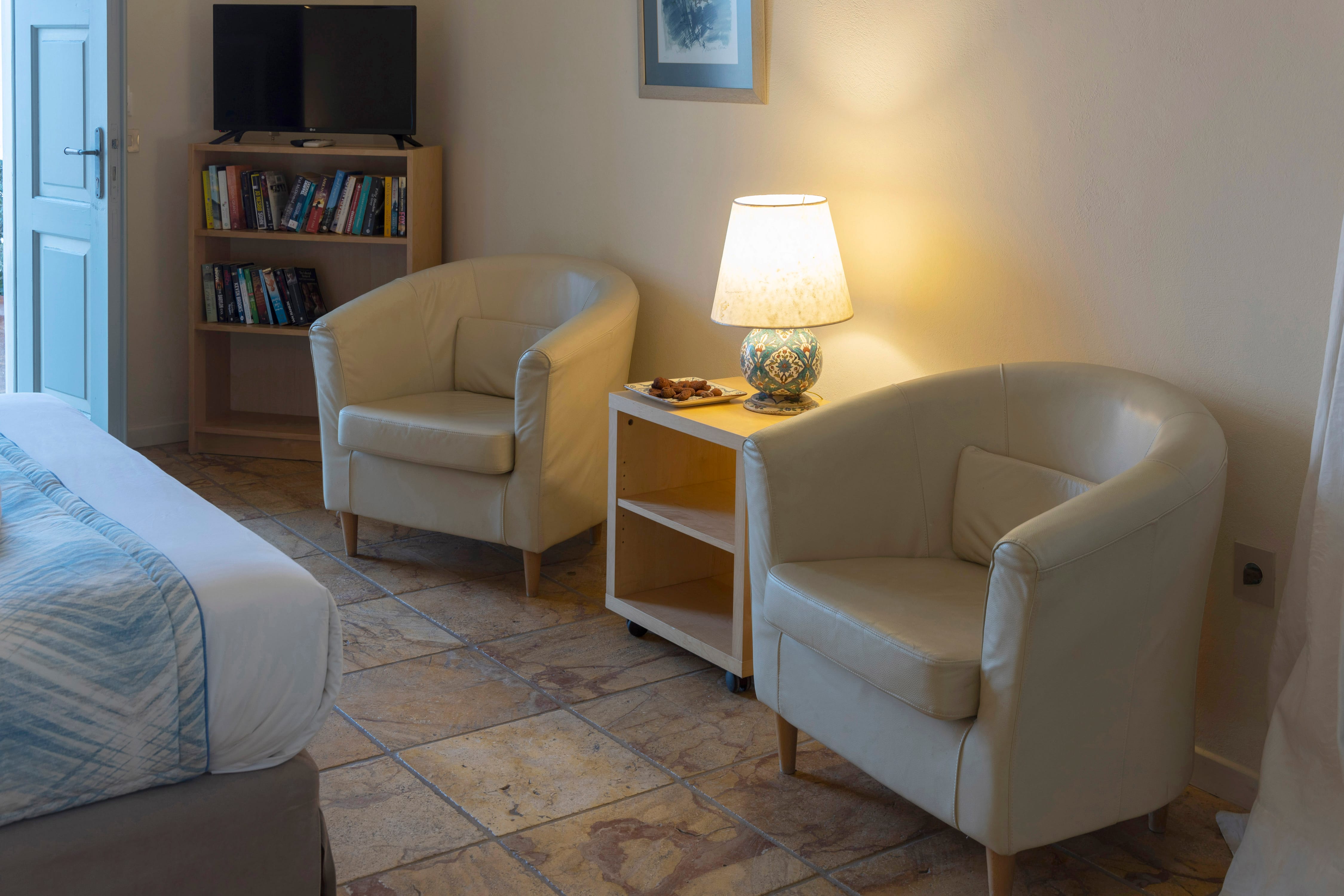 a room with a bed and a lamp