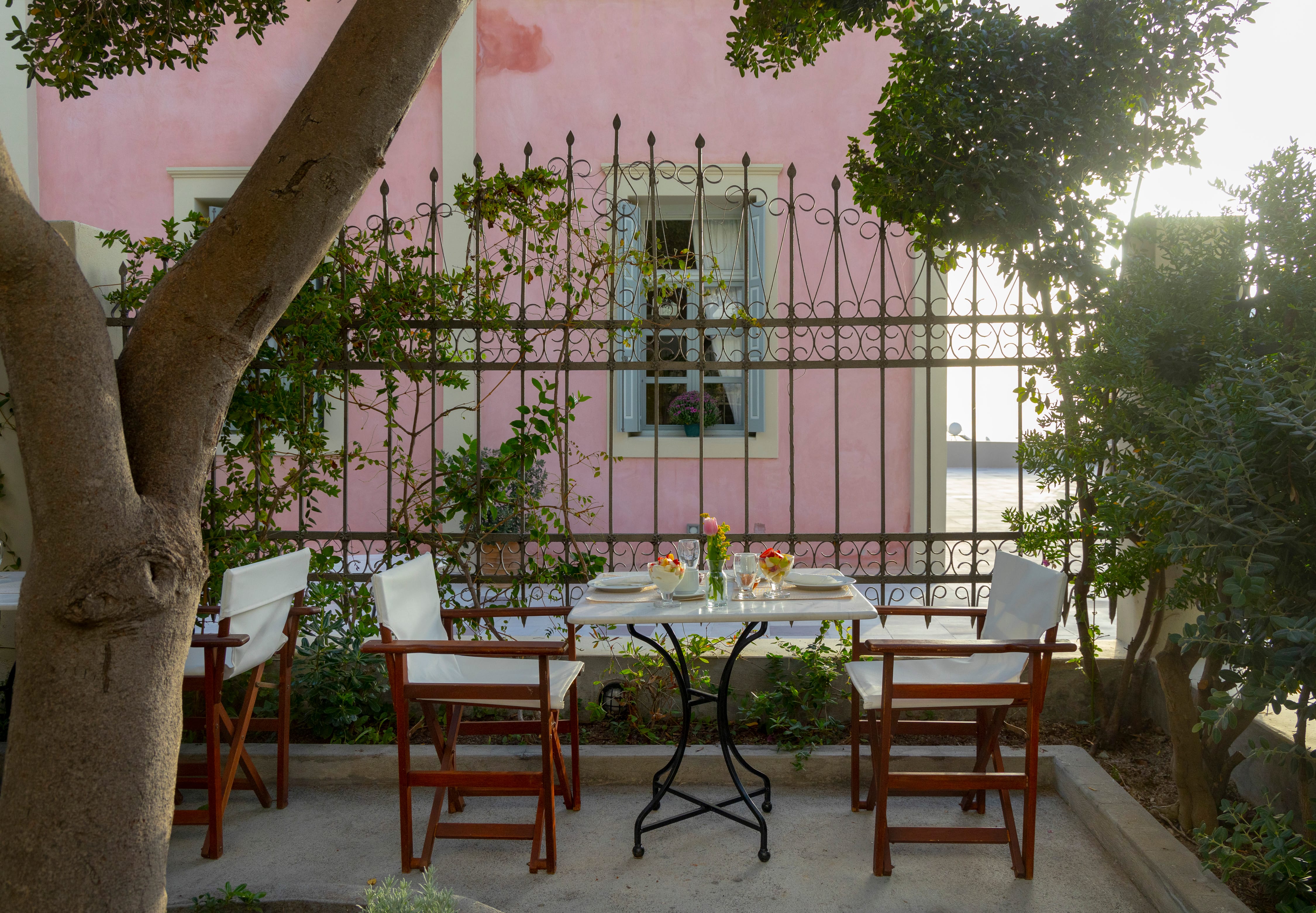 a table with chairs and a tree