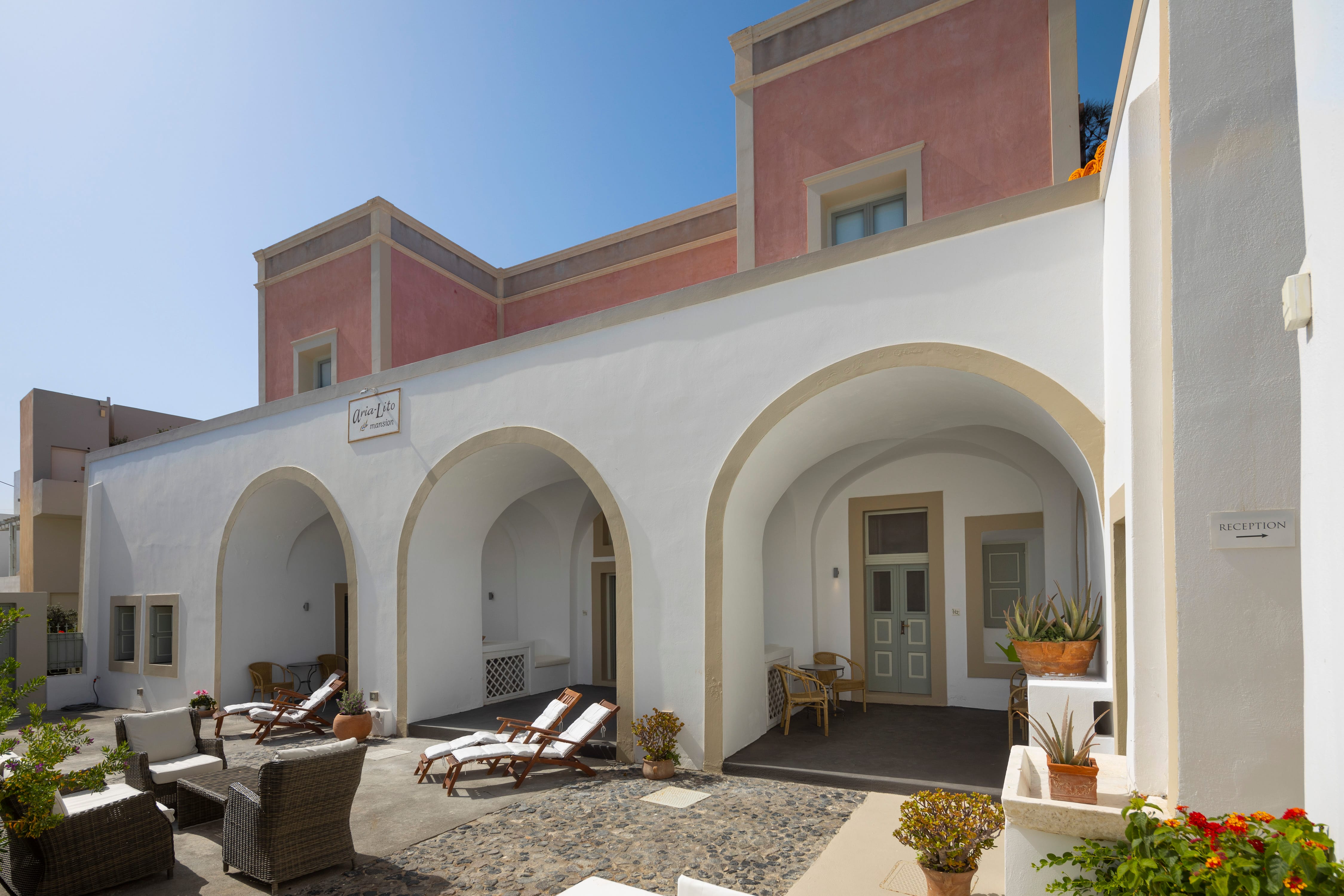 a building with a patio and chairs