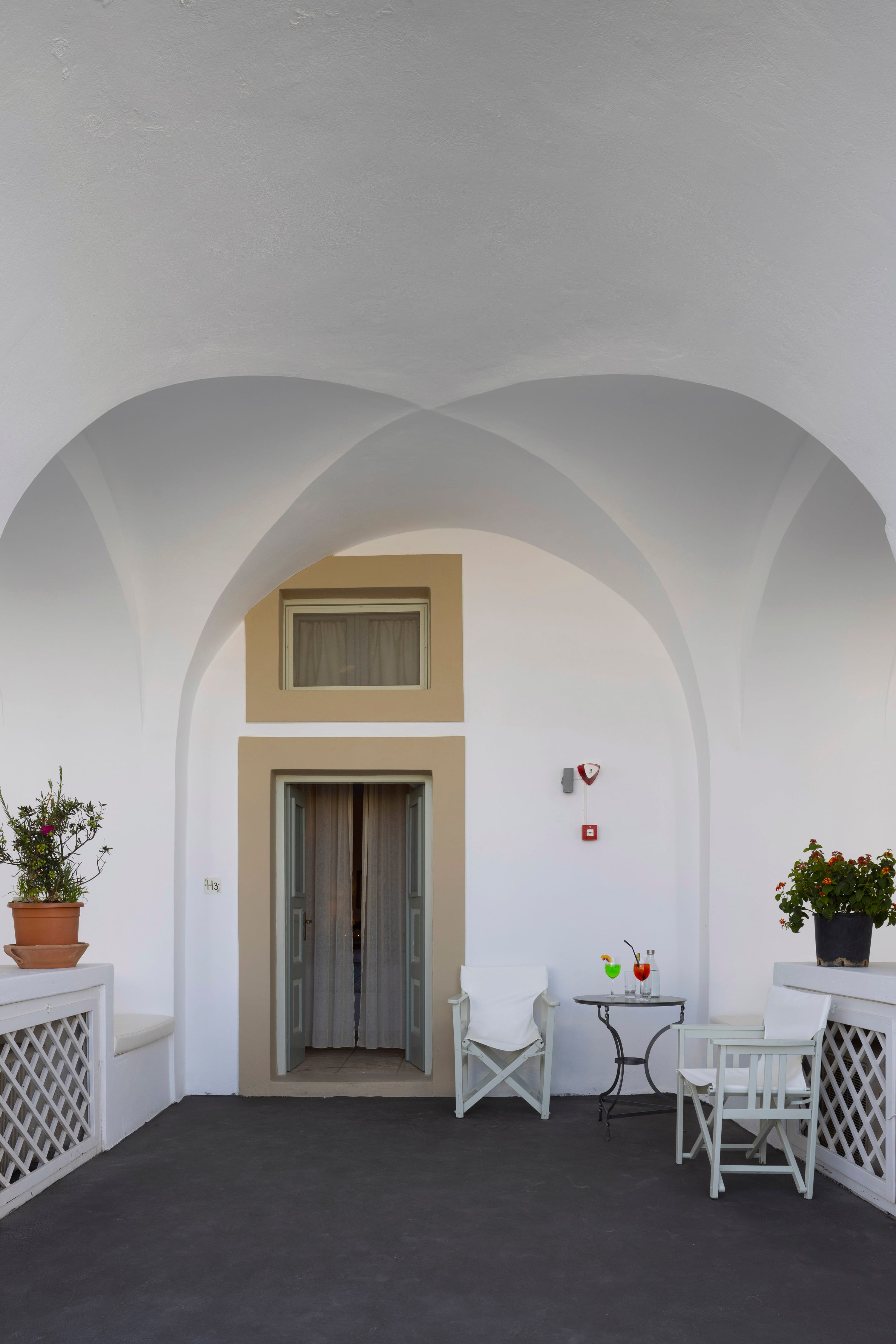 a room with a door and chairs