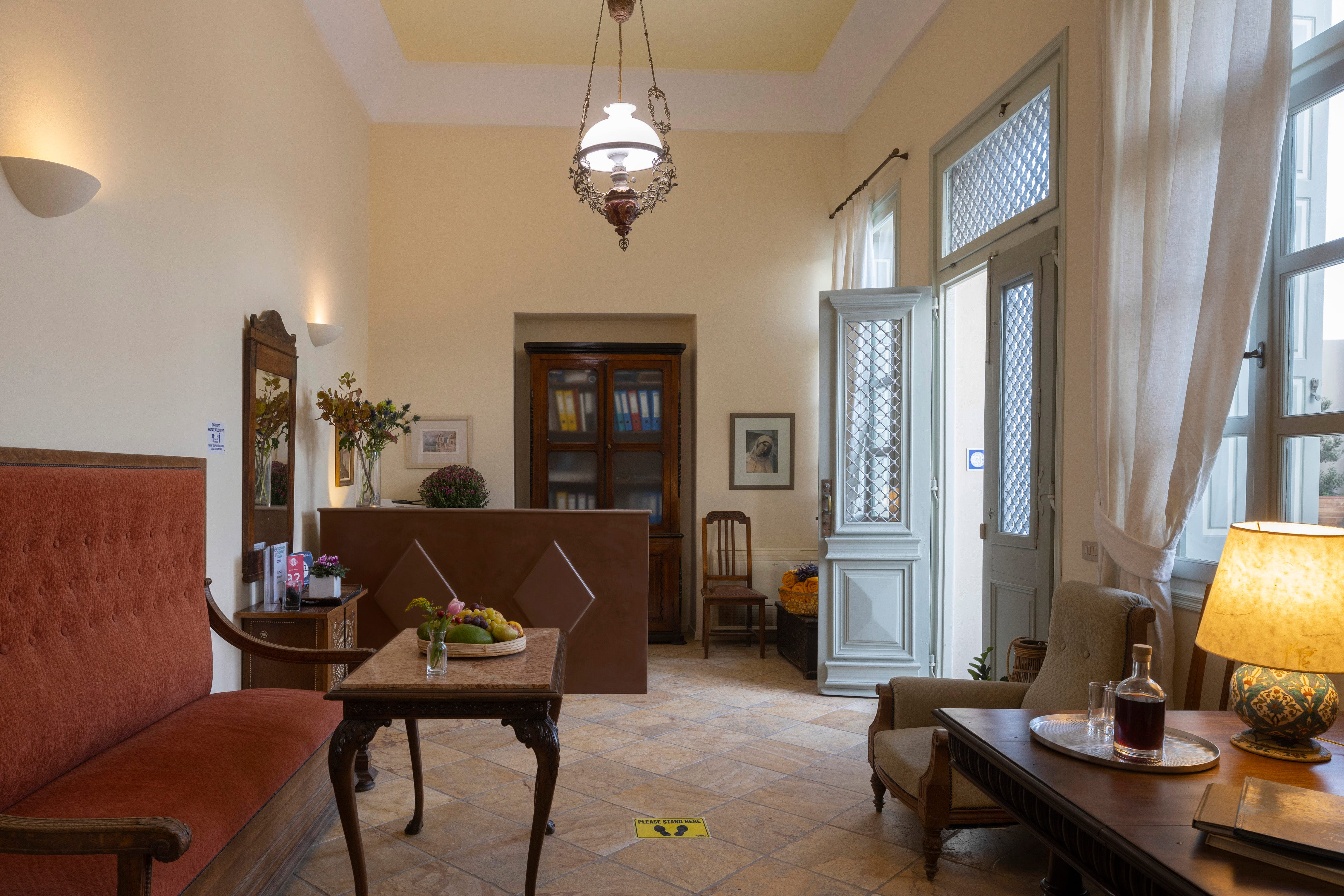 a living room with a table and chairs