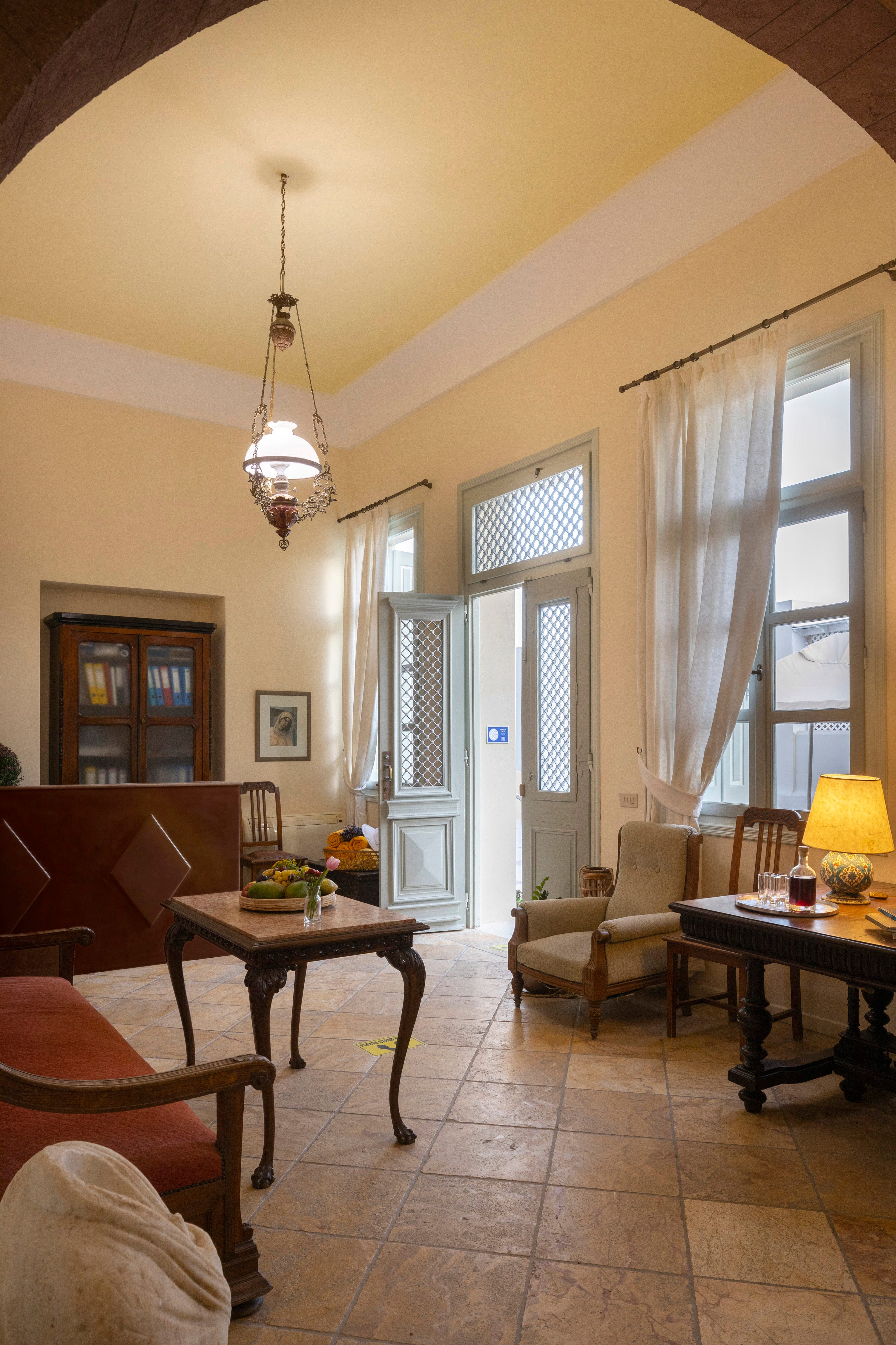 a living room with a chandelier and a table