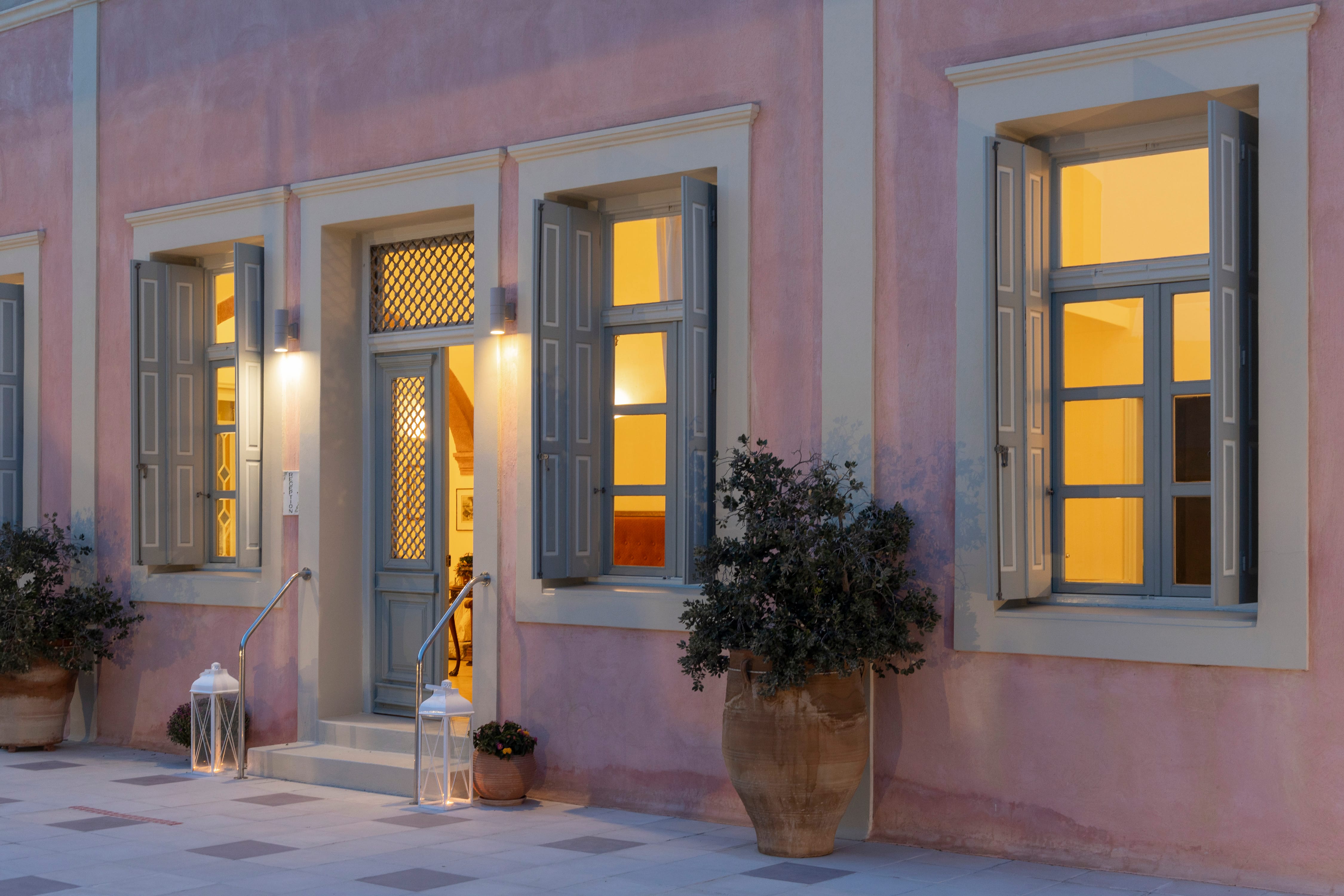 a pink house with windows