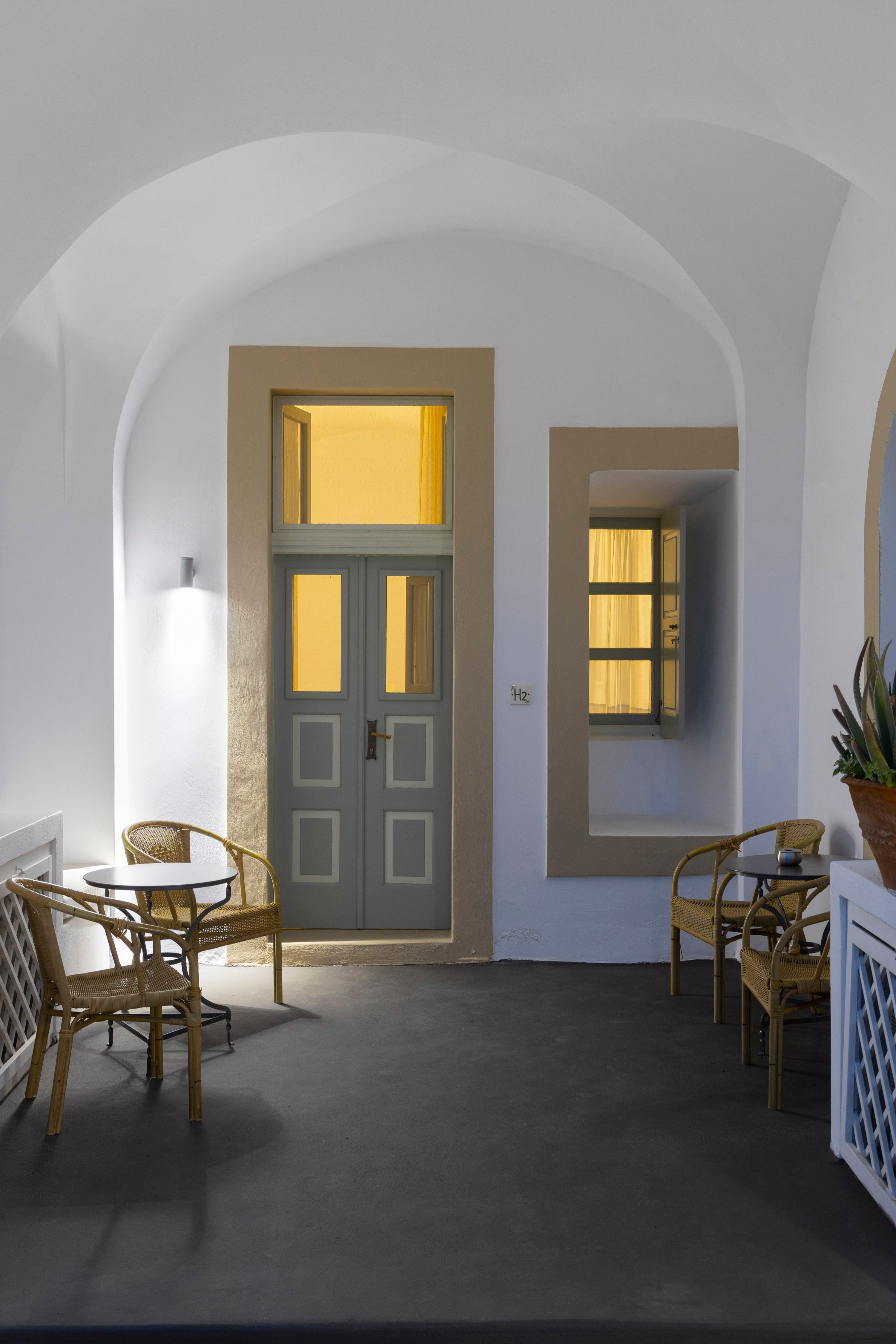 a room with a door and chairs