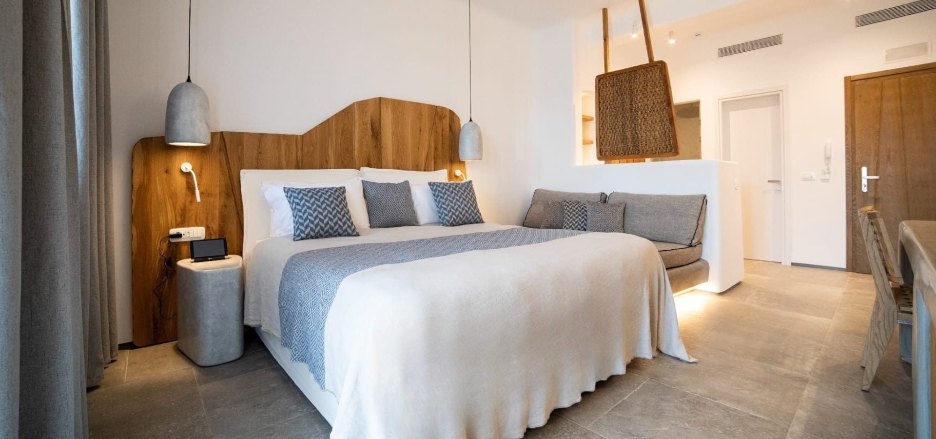 a bedroom with a bed and a couch