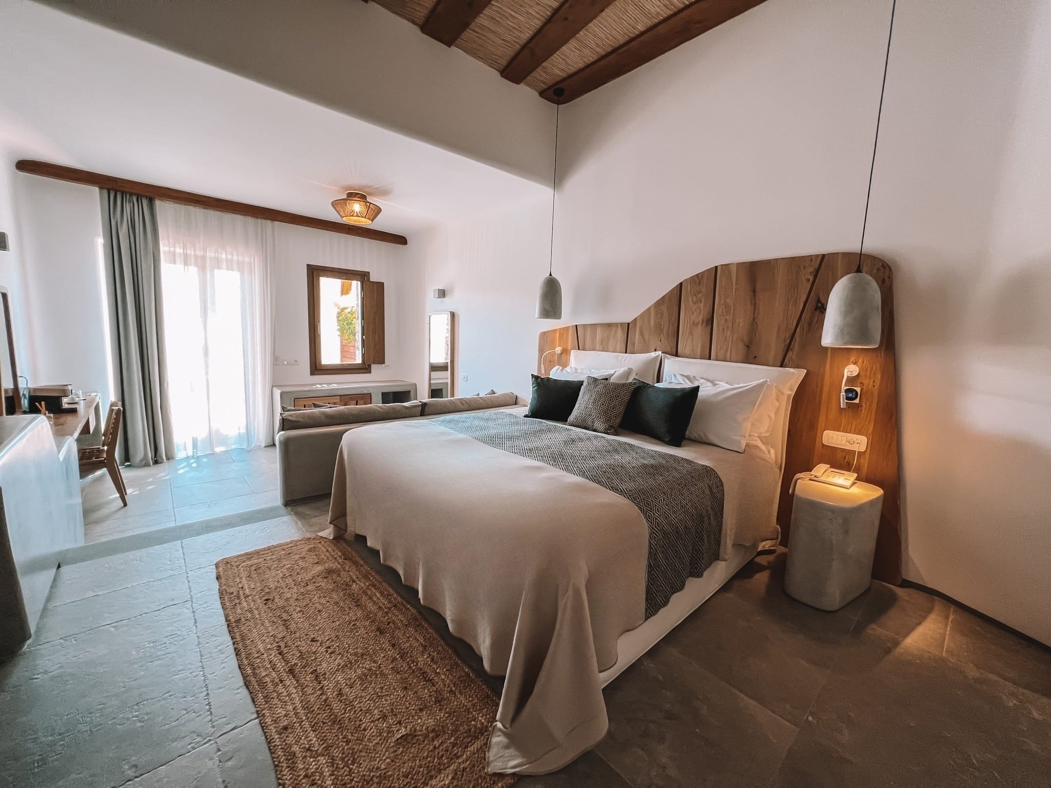 a bedroom with a bed and a lamp