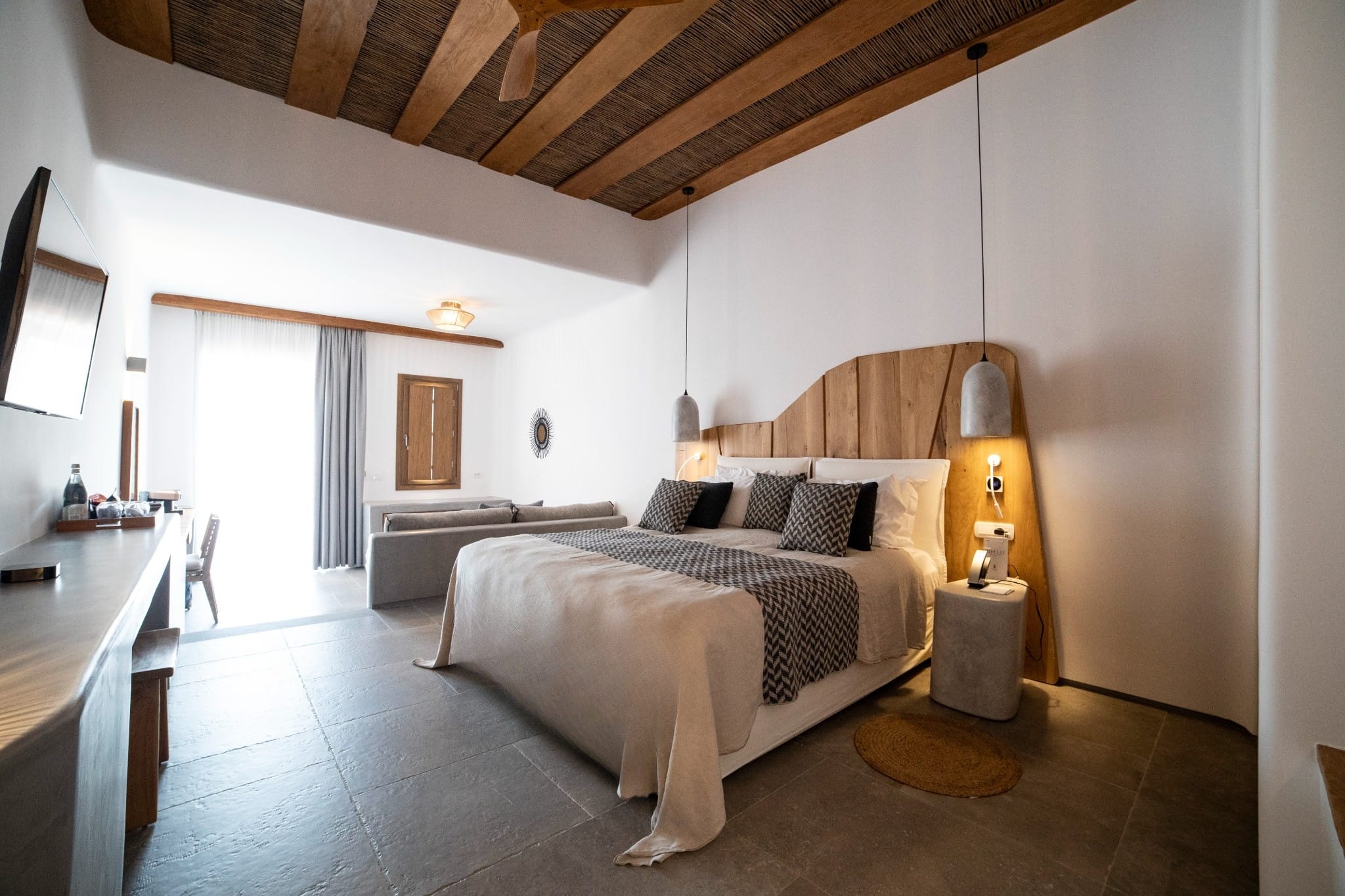 a bedroom with a bed and a lamp