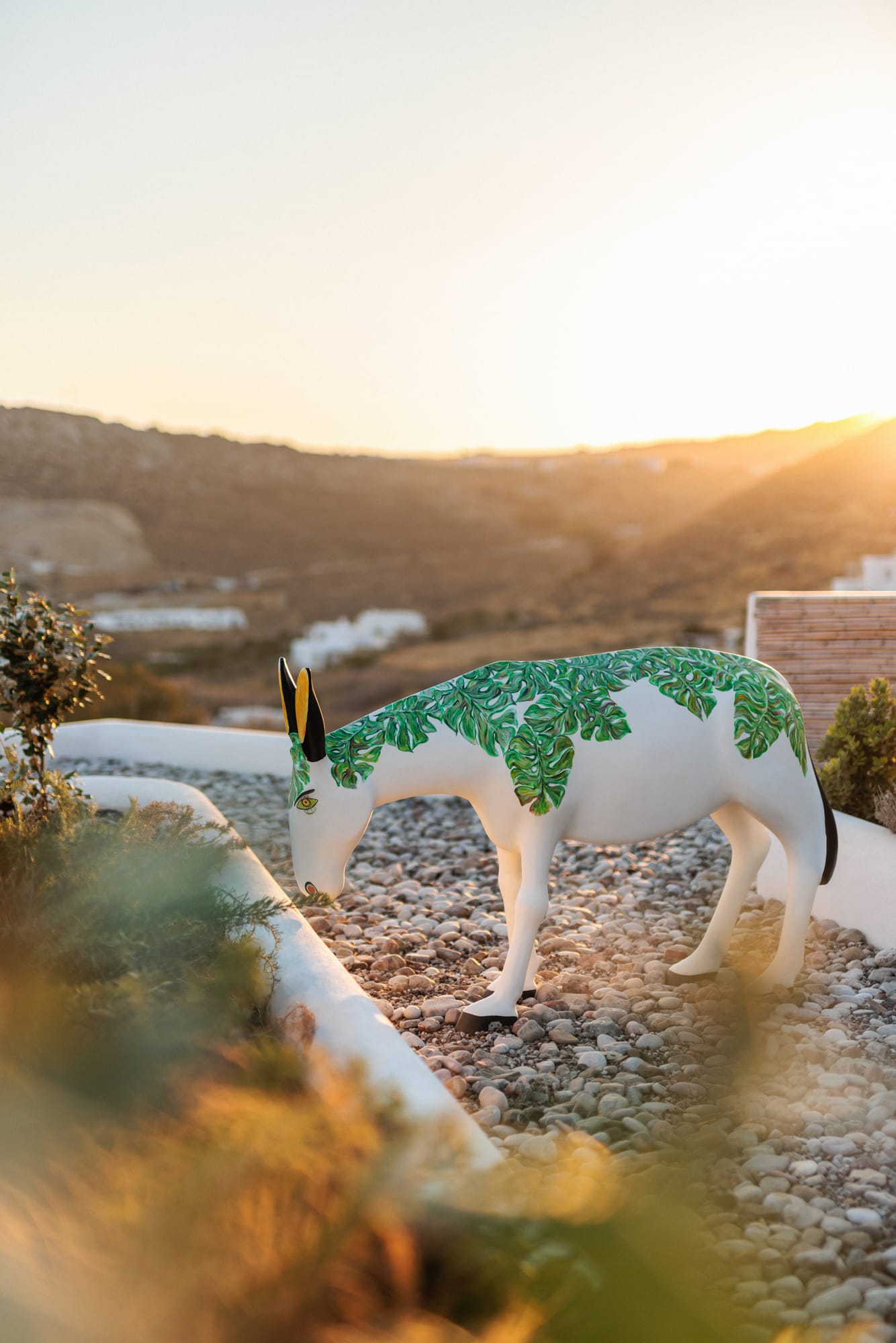 a white horse with green paint on it's face