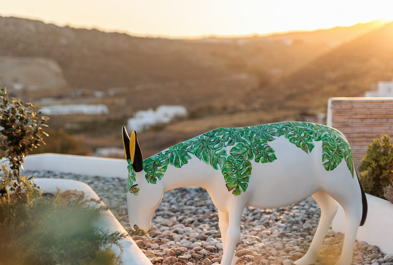 a white horse with green paint on it's face