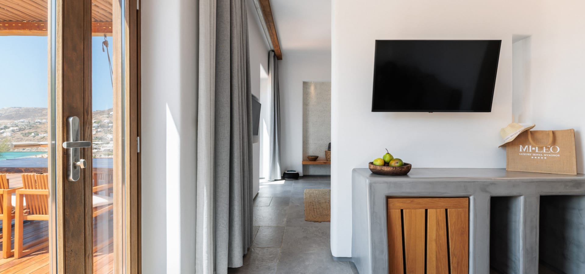 a room with a tv and a table