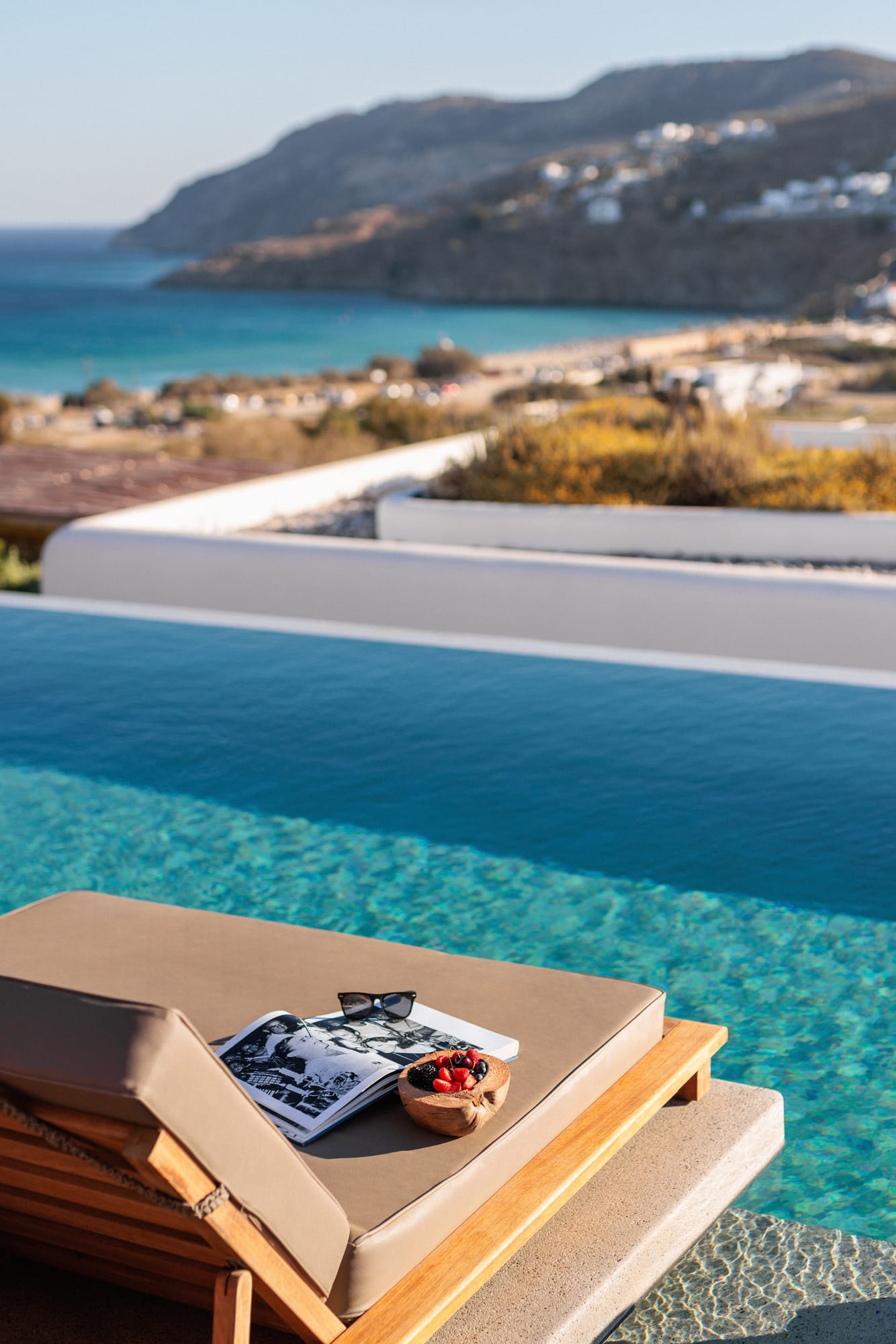 a box of food on a table by a pool