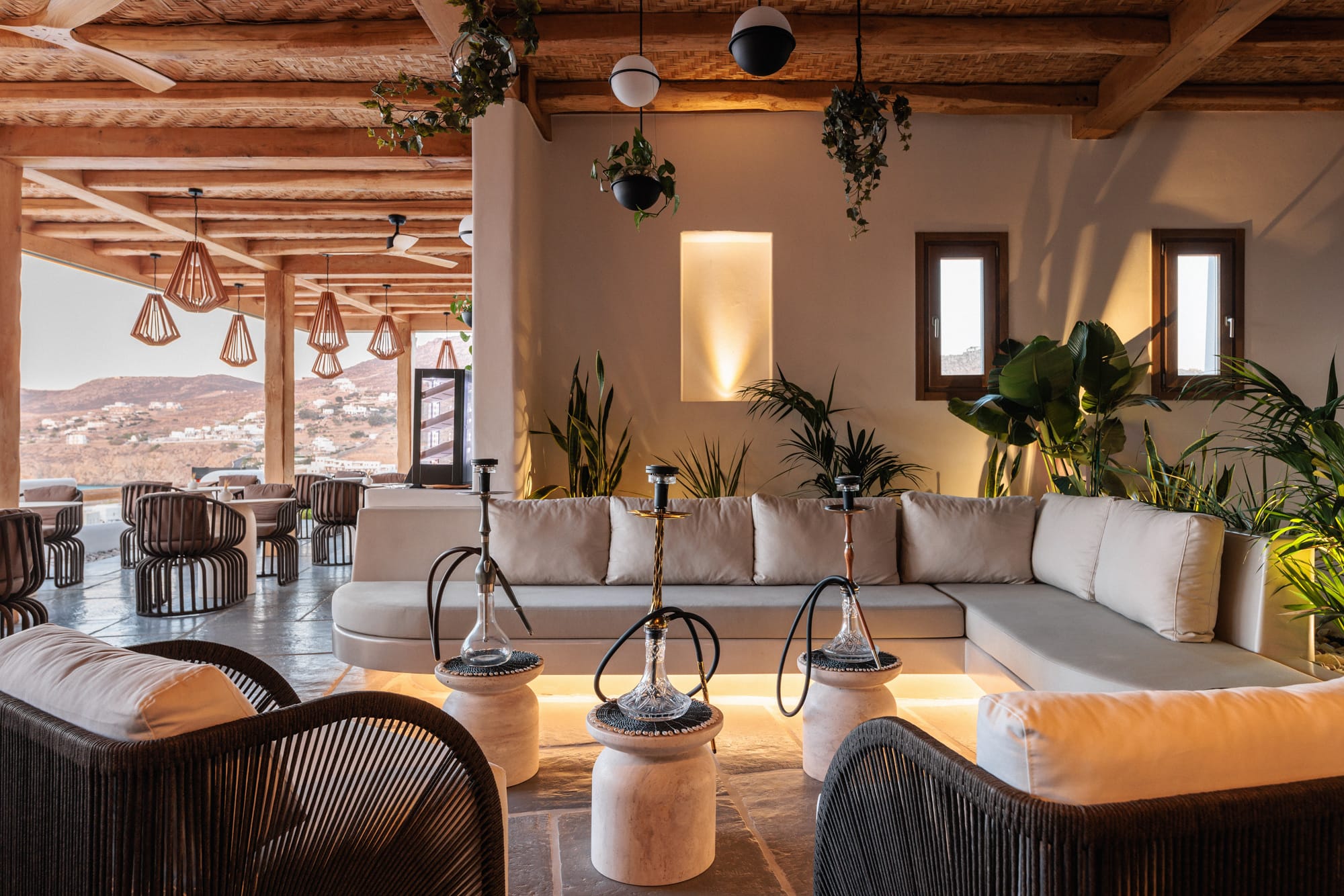 a room with a couch and chairs