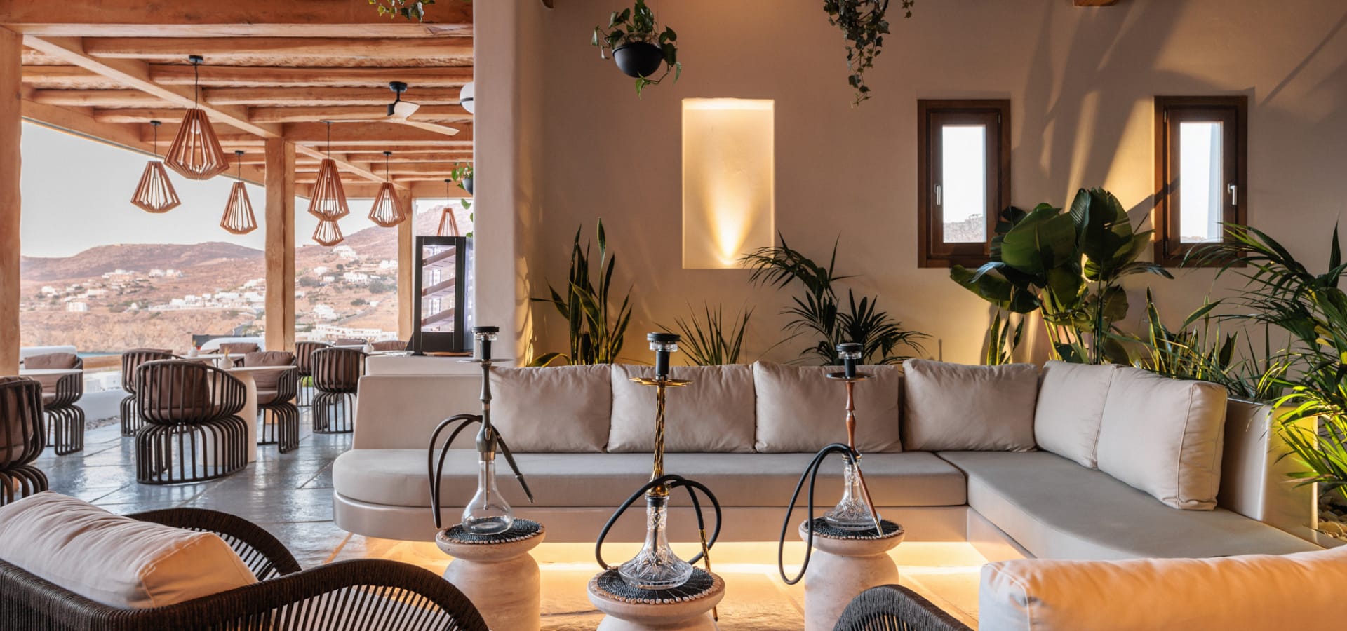 a room with a couch and chairs