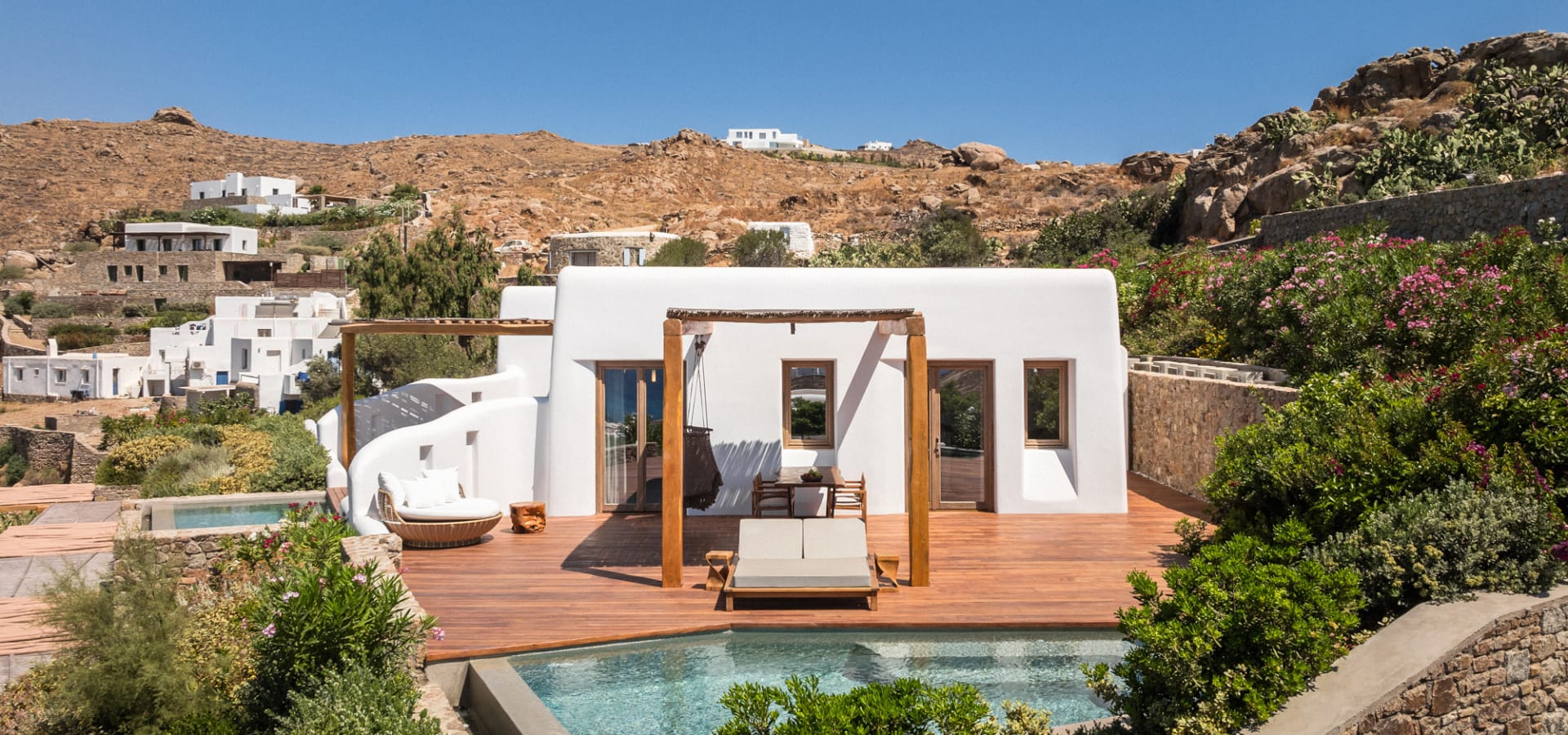 a house with a pool in the front