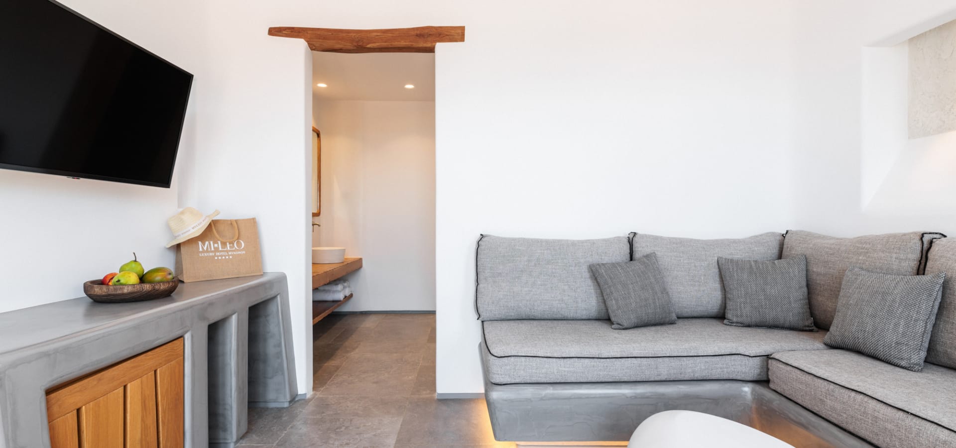 a living room with a couch and a tv