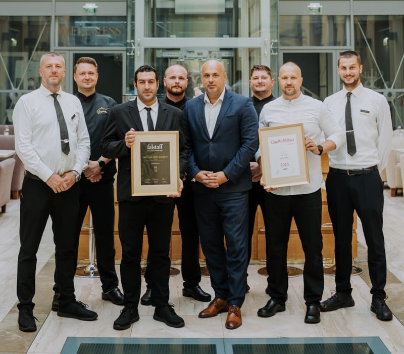 a group of men holding a plaque
