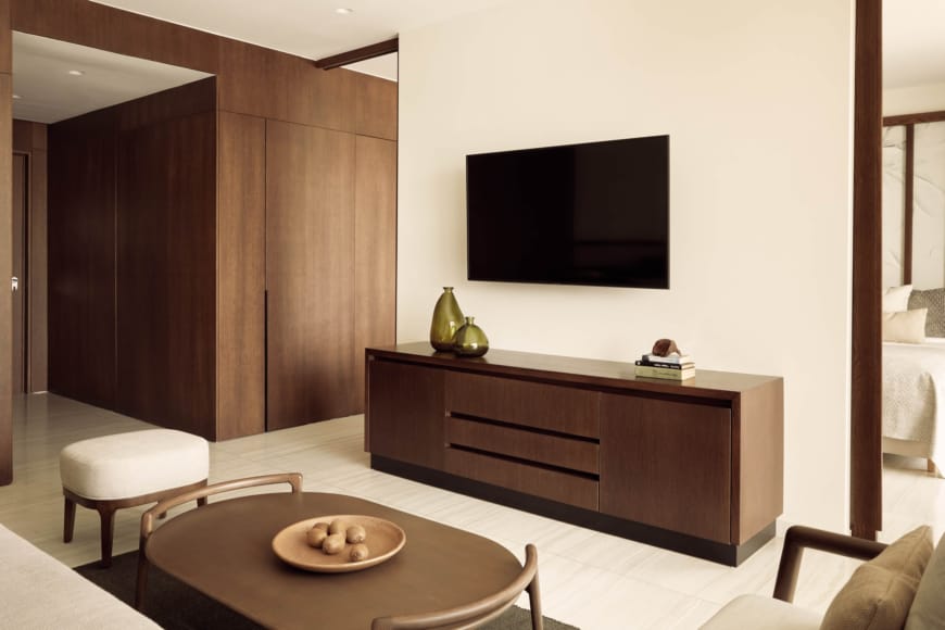 a living room with a tv on the wall