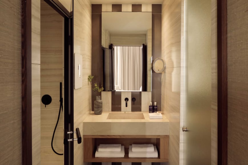 a bathroom with a mirror and sink