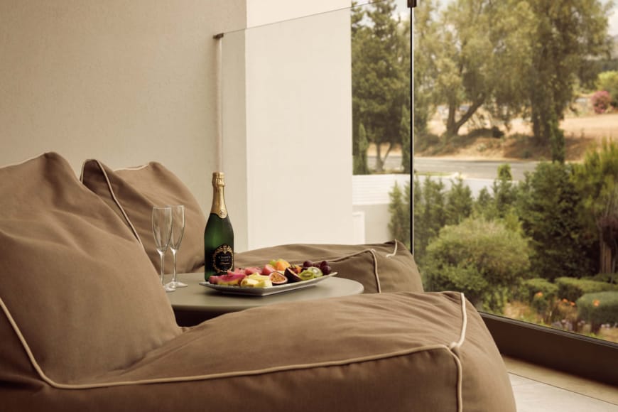 a champagne and snacks on a table