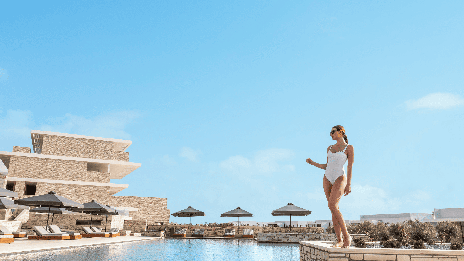 a person jumping into a pool