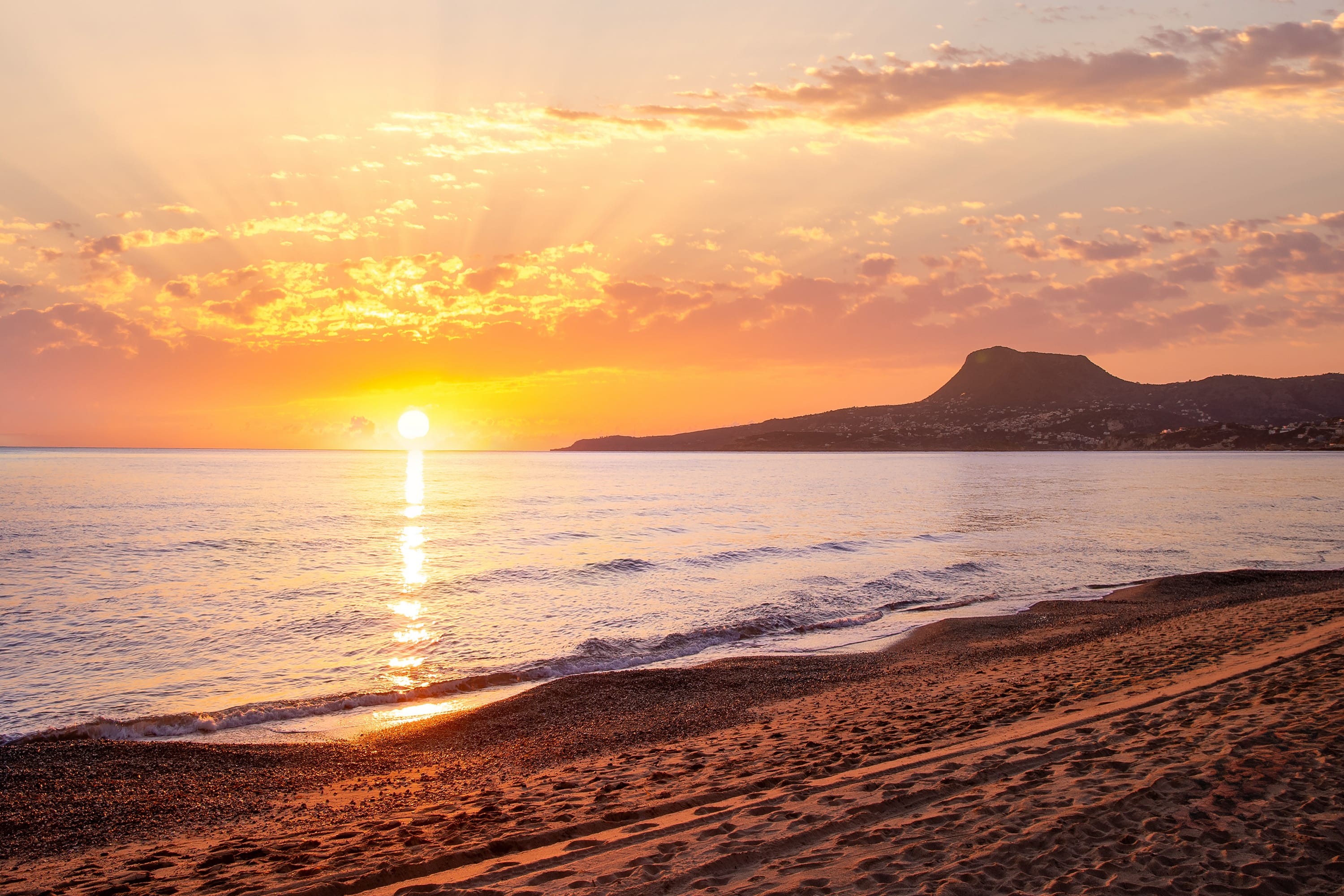 a sunset over a beach