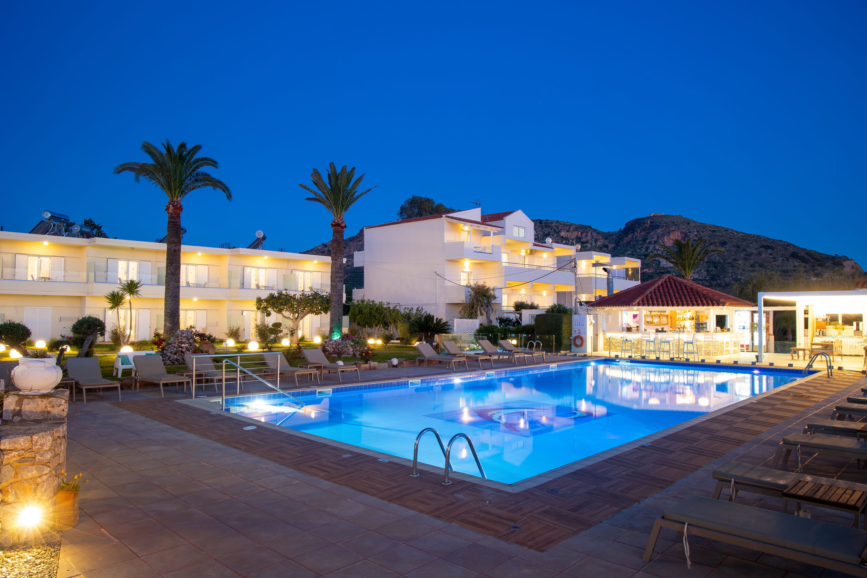 a swimming pool in front of a hotel