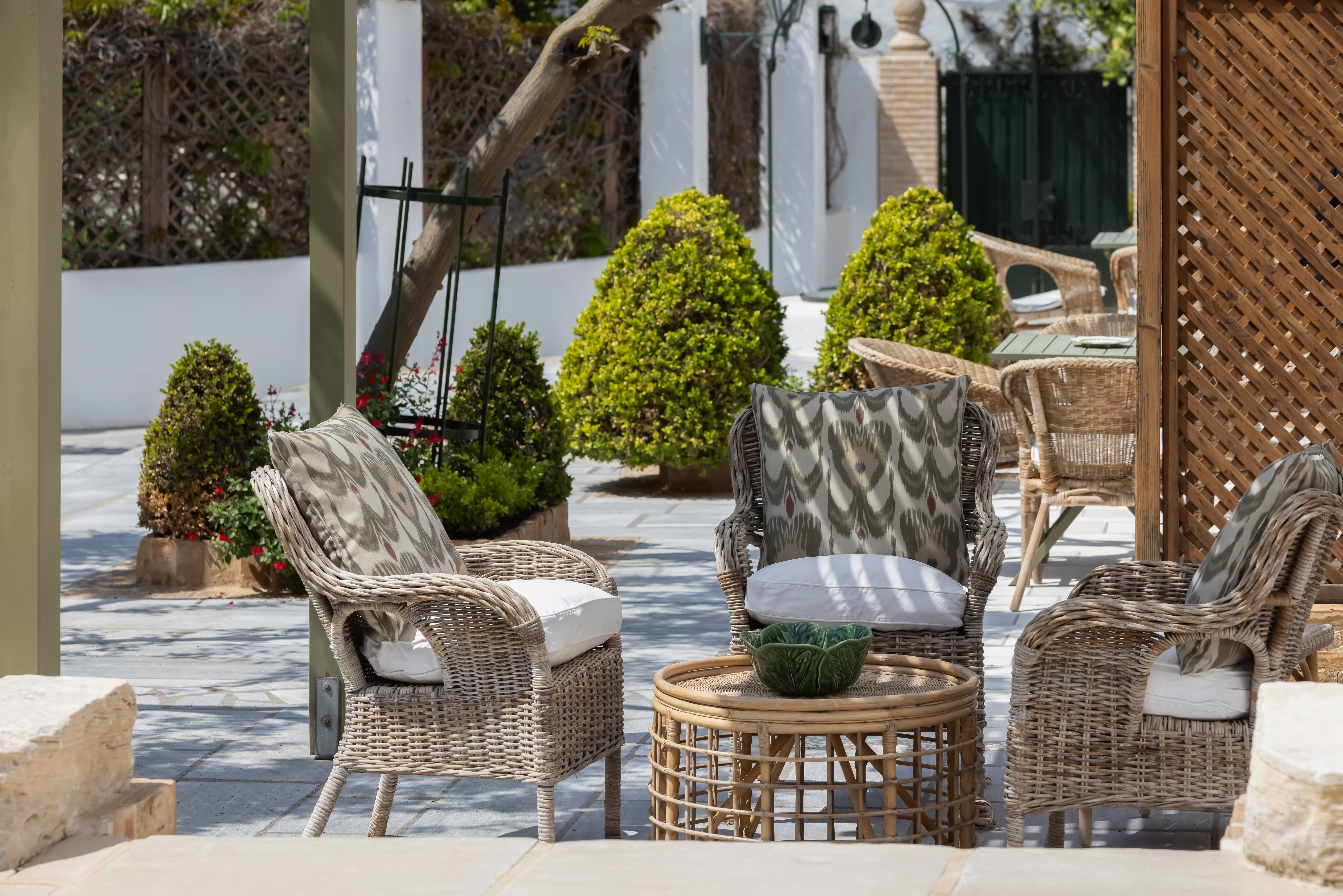a patio area with chairs and tables