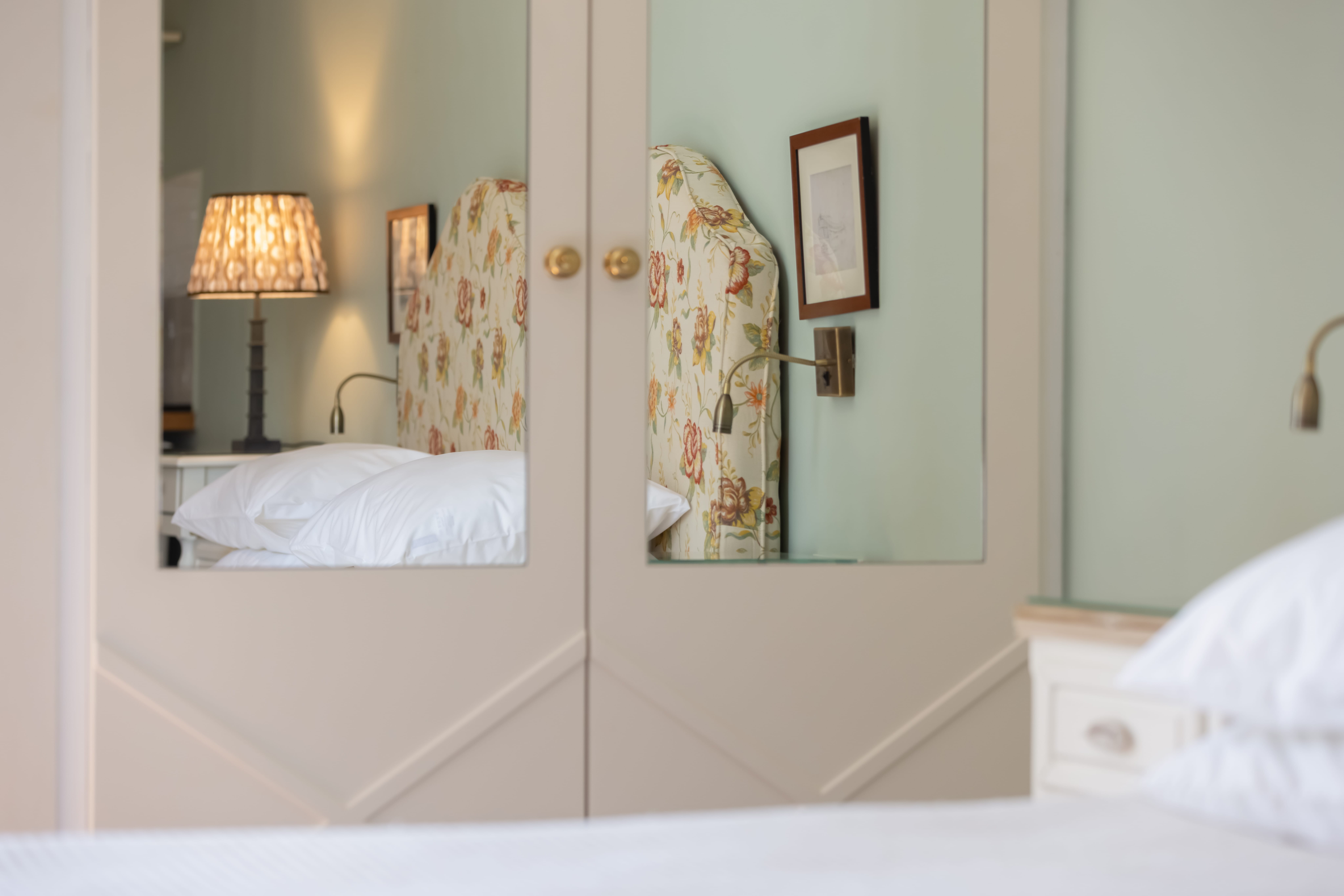 a mirror of a bedroom