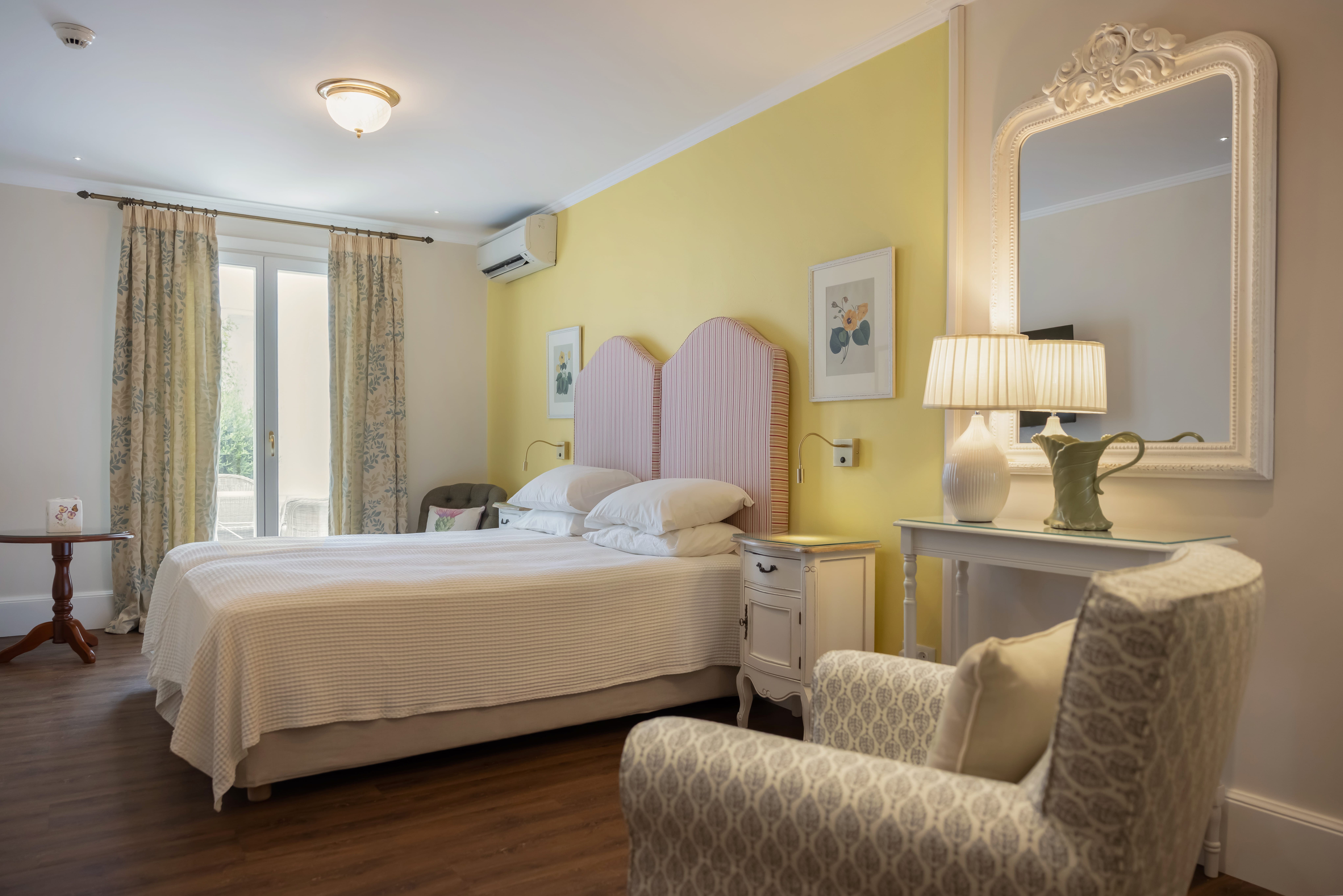 a room with two beds and a mirror
