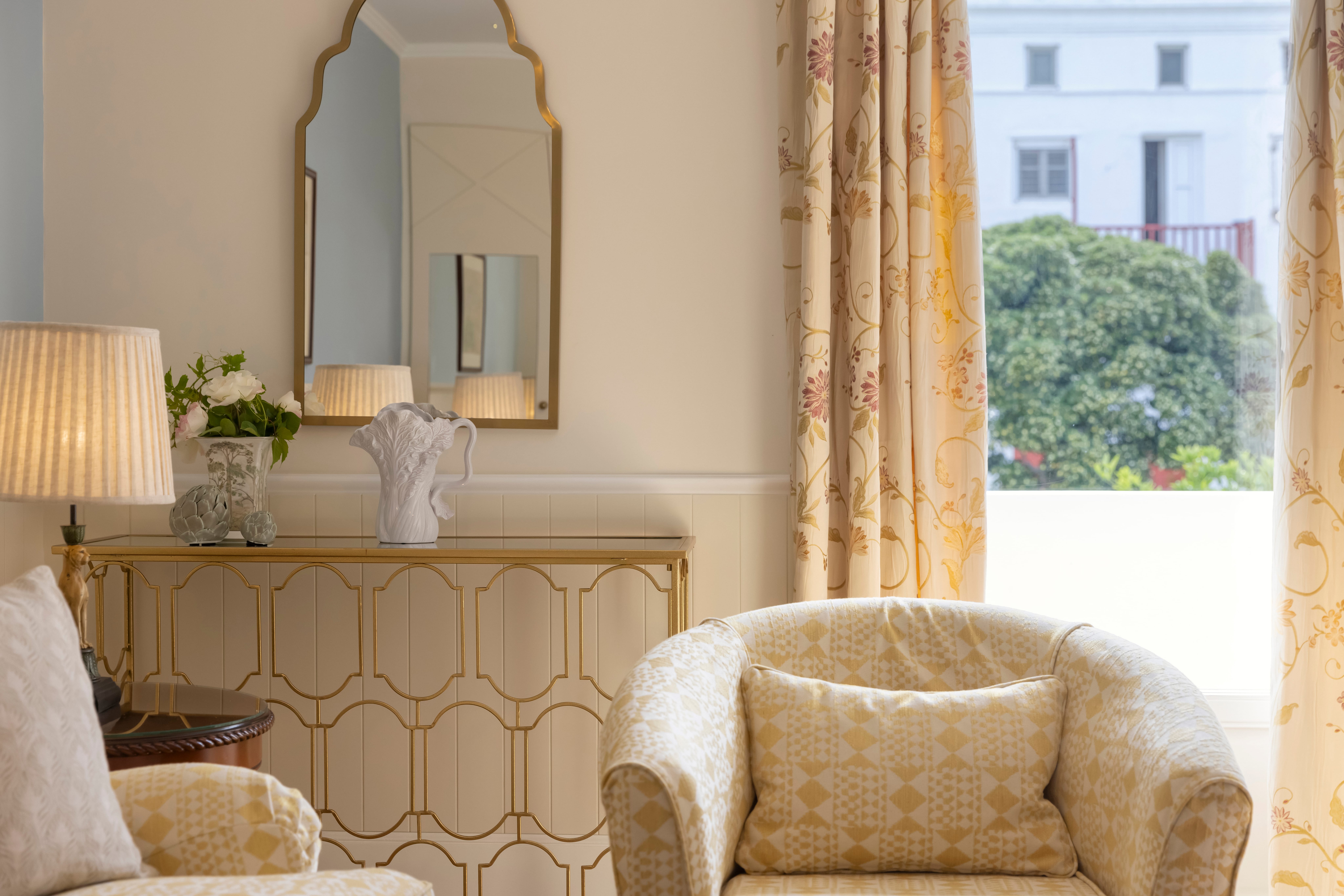 a room with a mirror and a chair