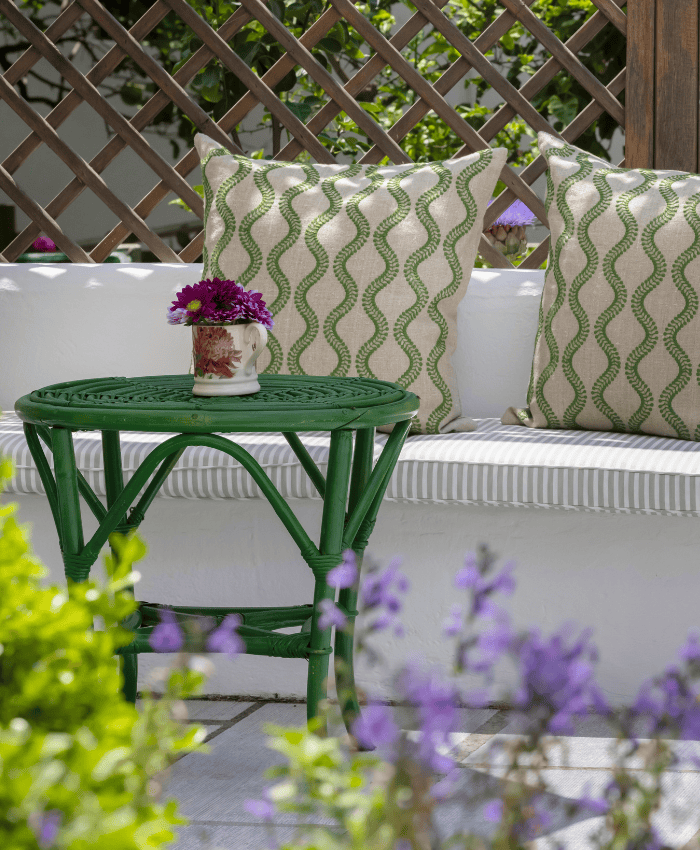a green table with purple flowers on it