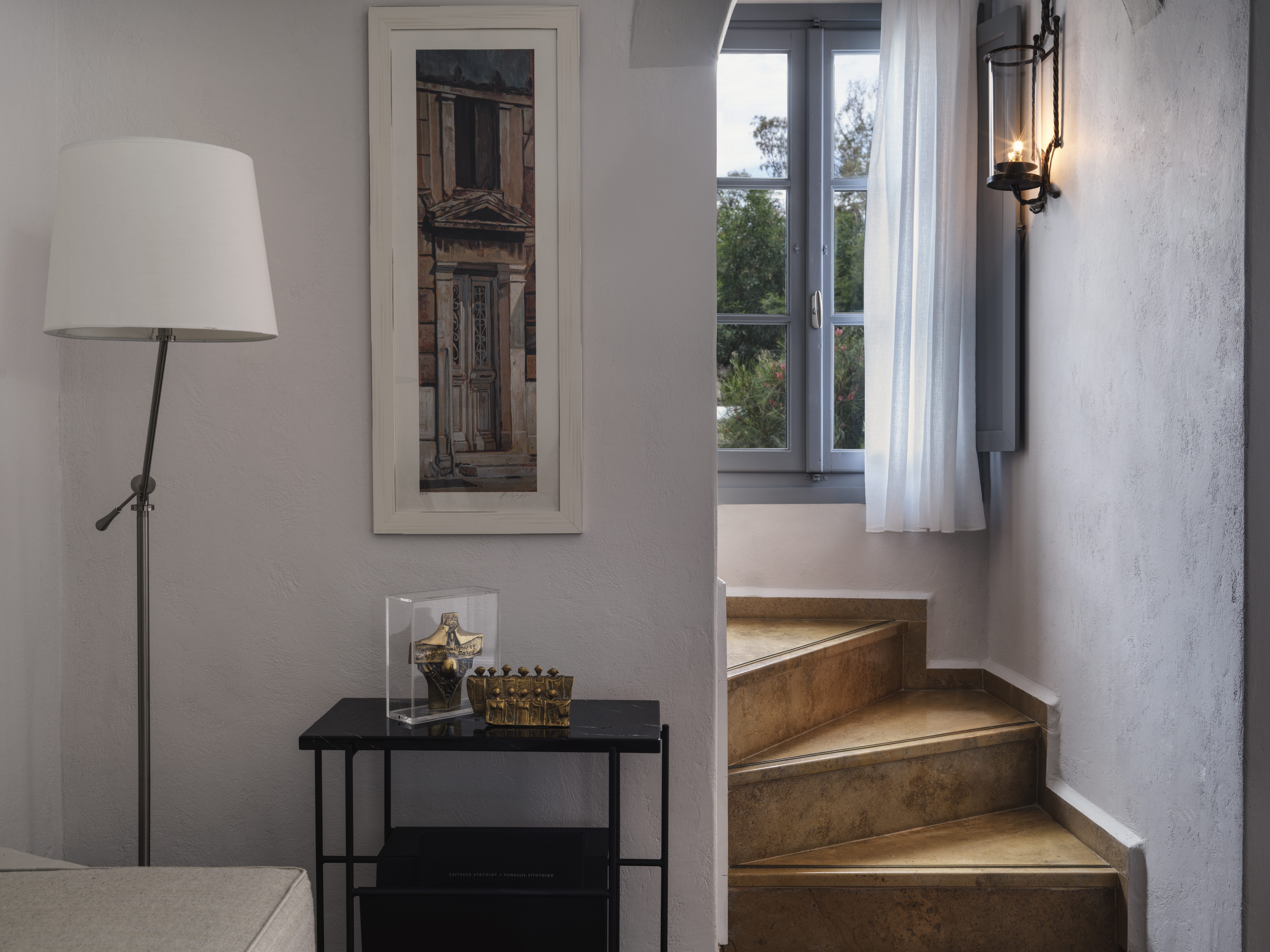 a room with a table and a lamp