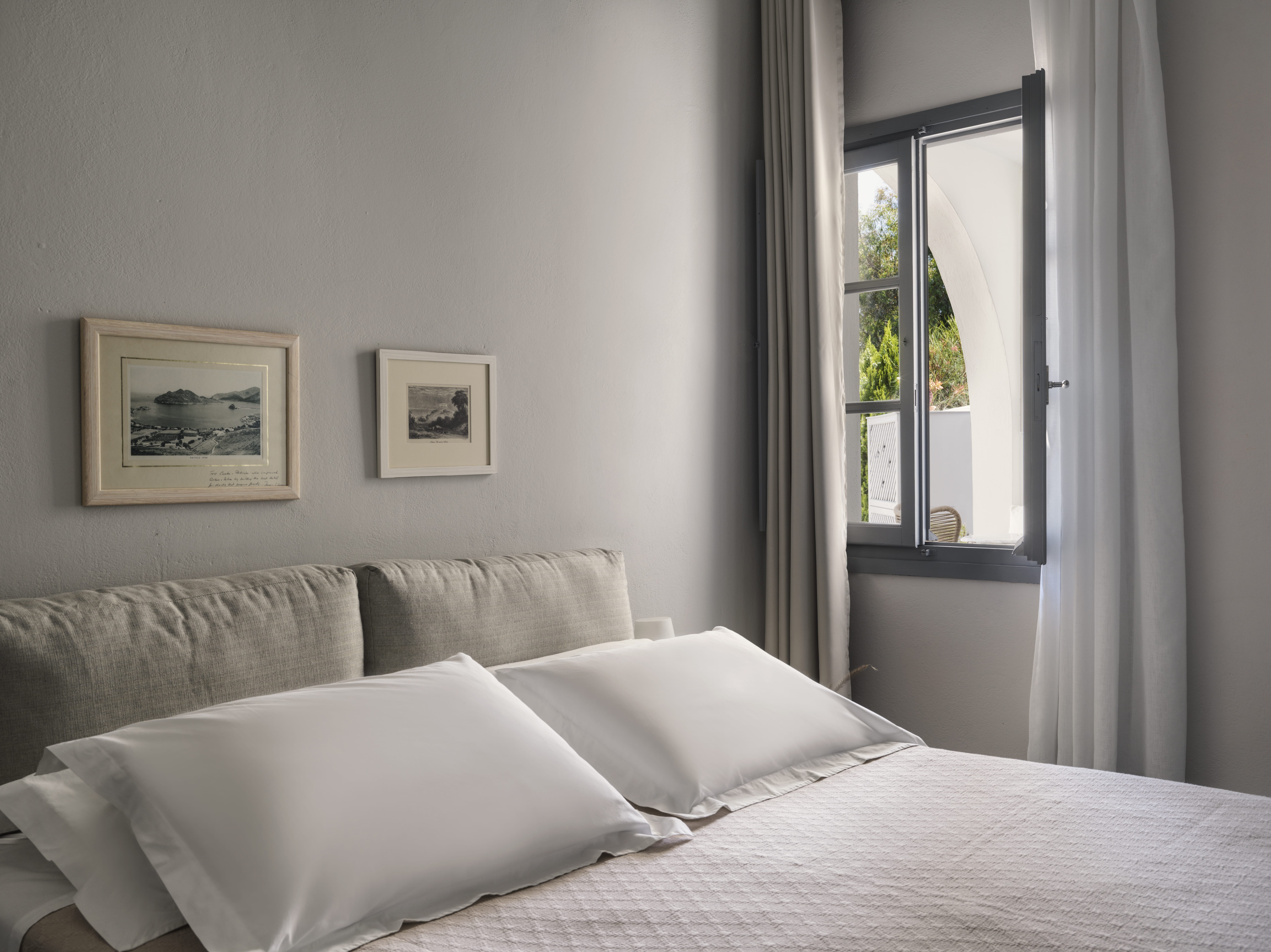 a bed with white pillows