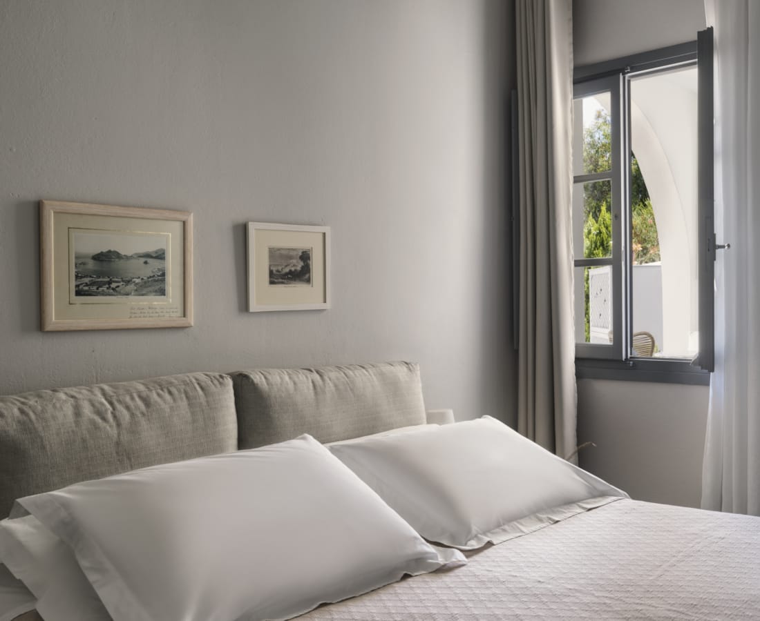 a bed with white pillows